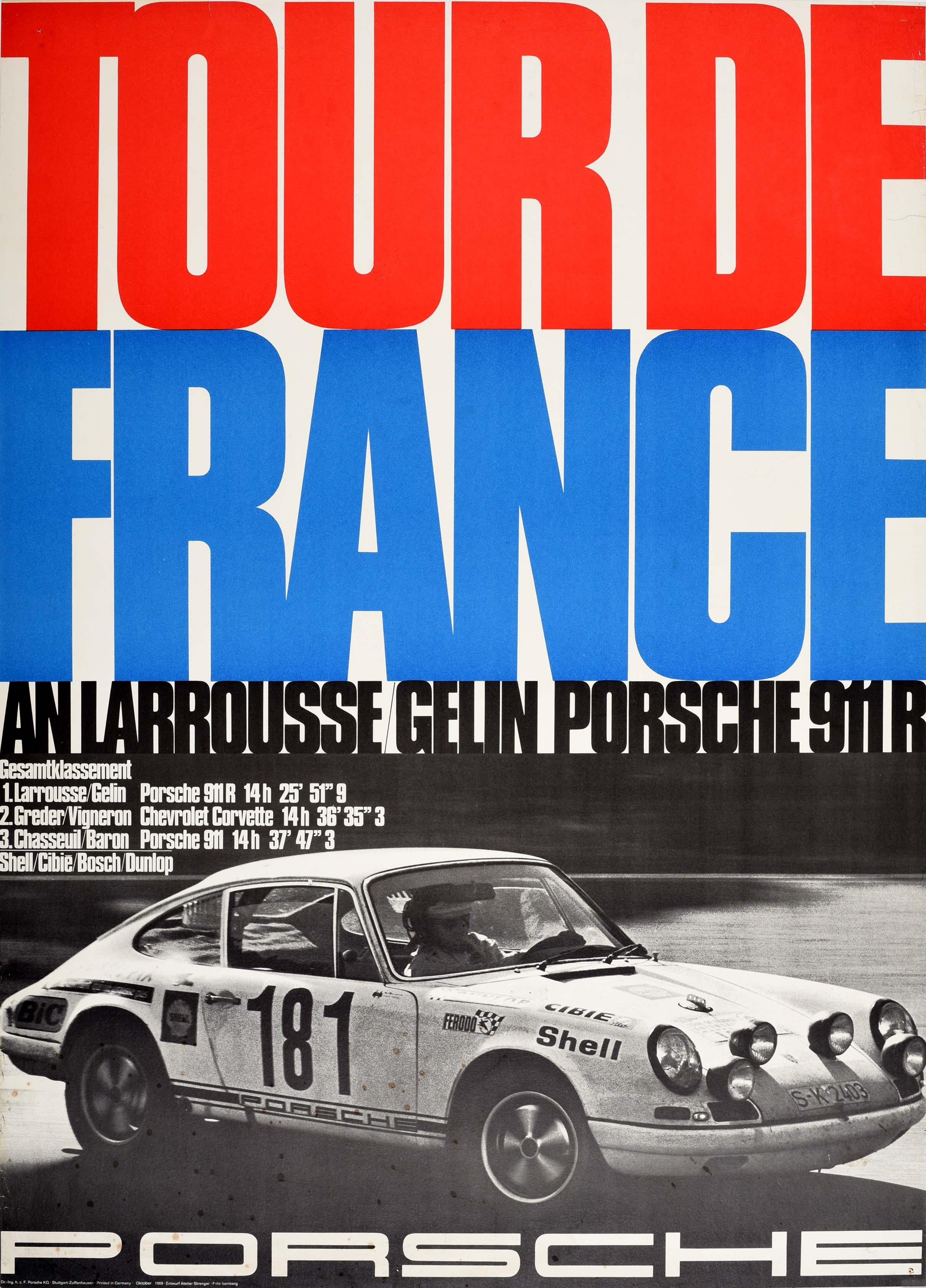 Original vintage motorsport poster issued by Porsche celebrating their win at the 1969 Tour De France by Larrousse / Gelin Porsche 911R - featuring a black and white photo of a Porsche racing car numbered 181 driving at speed pas the viewer with the