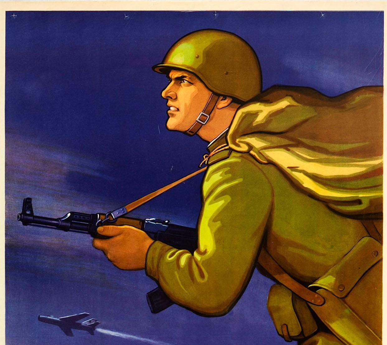 Original vintage Cold War era Soviet propaganda poster - Learn to Advance Swiftly and Bravely! Dynamic artwork showing an infantry soldier in uniform holding his Kalashnikov automatic rifle gun and striding into battle in the foreground with more