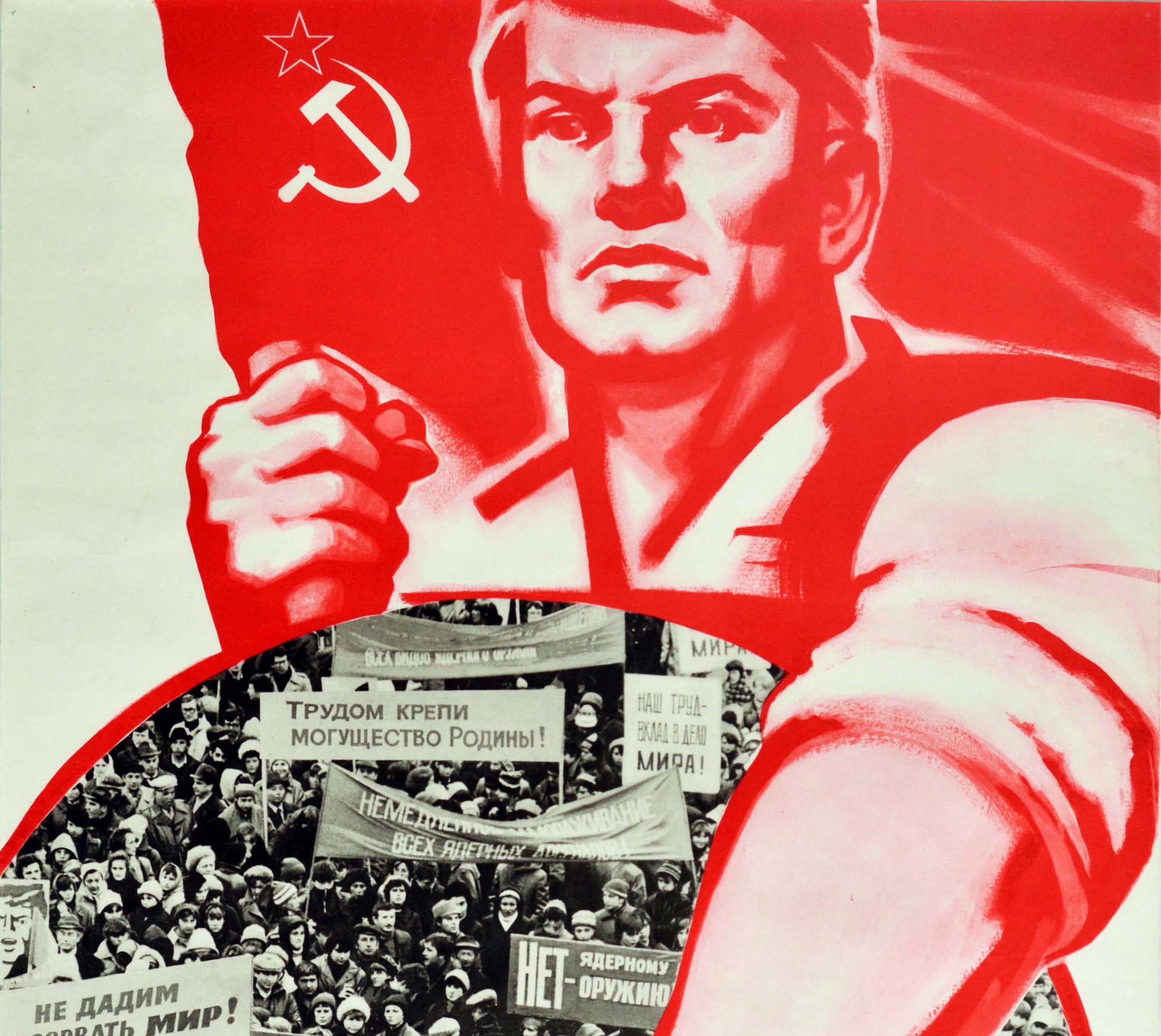 Original vintage Soviet propaganda poster against nuclear arms featuring an image of a man in red and white holding a red hammer and sickle star flag in a tight fist and pointing at the text in Russian that reads ????????? ??? ??????? ?????? ?? ????