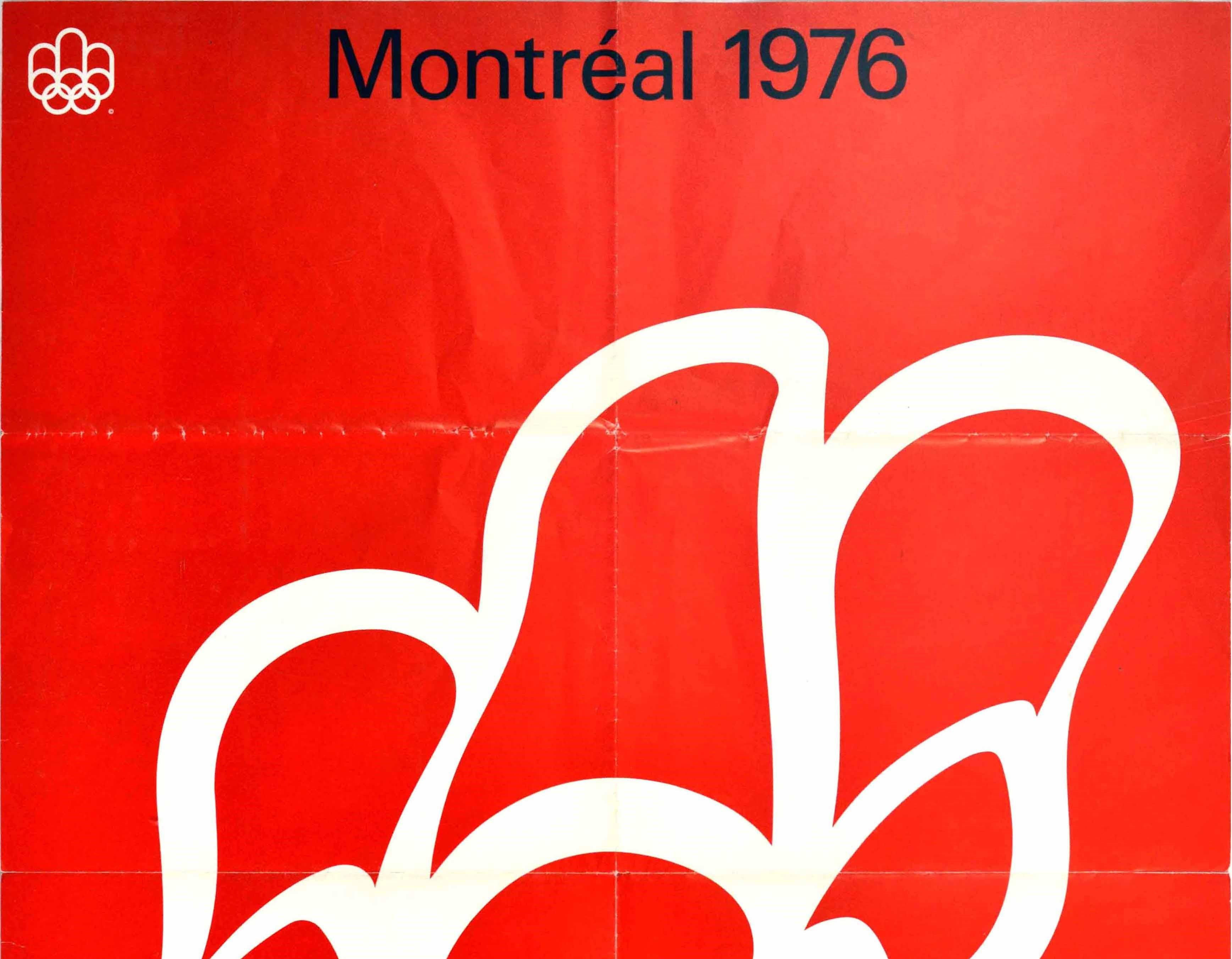 Original vintage sport advertising poster for the Summer Olympic Games 1976 held in Montreal featuring the read and white colours of the Canadian flag with the Olympic rings in white floating on a red background and the bold black letters above with