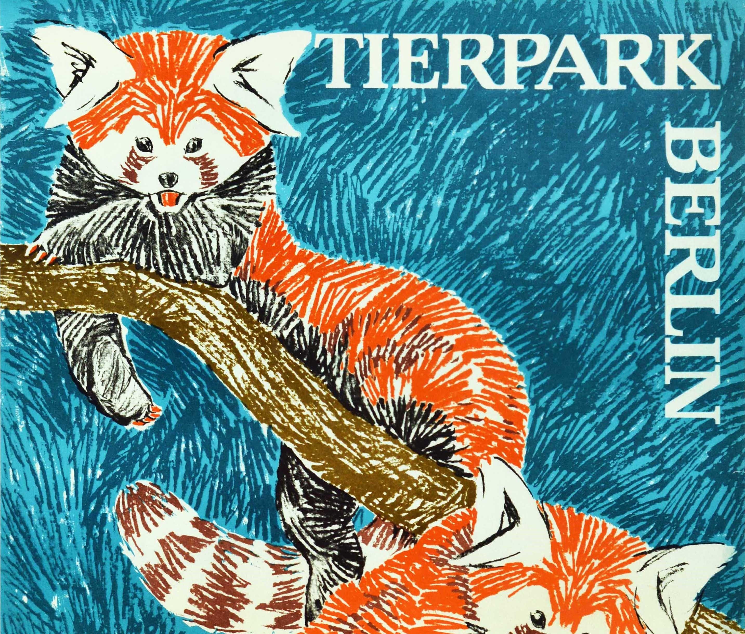 Original vintage poster for the Tierpark Berlin Zoo featuring a fantastic sketched image of two red pandas on a tree branch against a blue background. Berlin Zoo was founded in 1955. Very good condition, minor creasing, small tears on edges.
