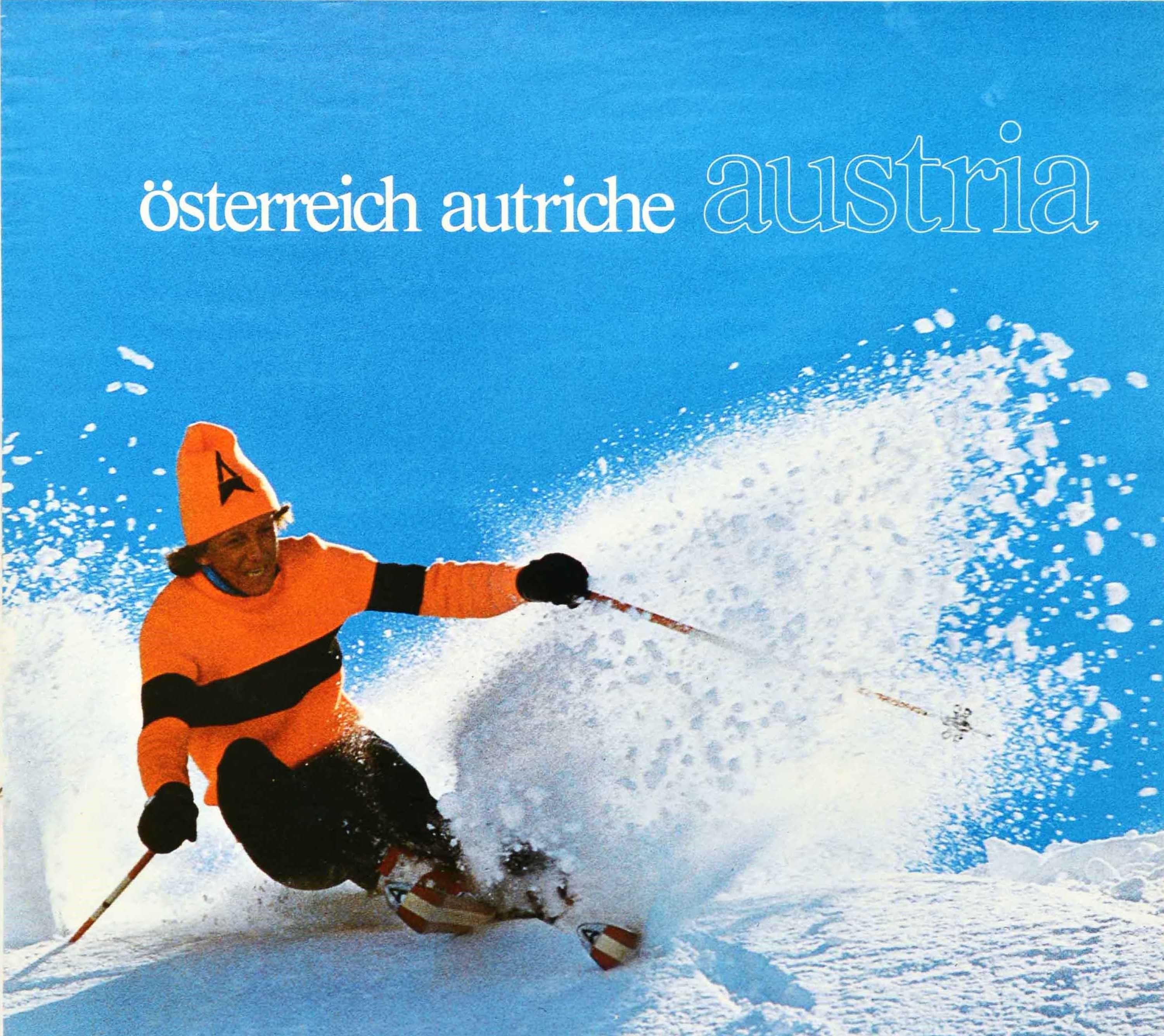 Original vintage winter sport travel poster for Osterreich Autriche Austria depicting a lady skiing down a snowy mountain at speed in the sunshine with the bold white text on the blue sky above. Published by Osterreichische Fremdenverkehrswerbung,