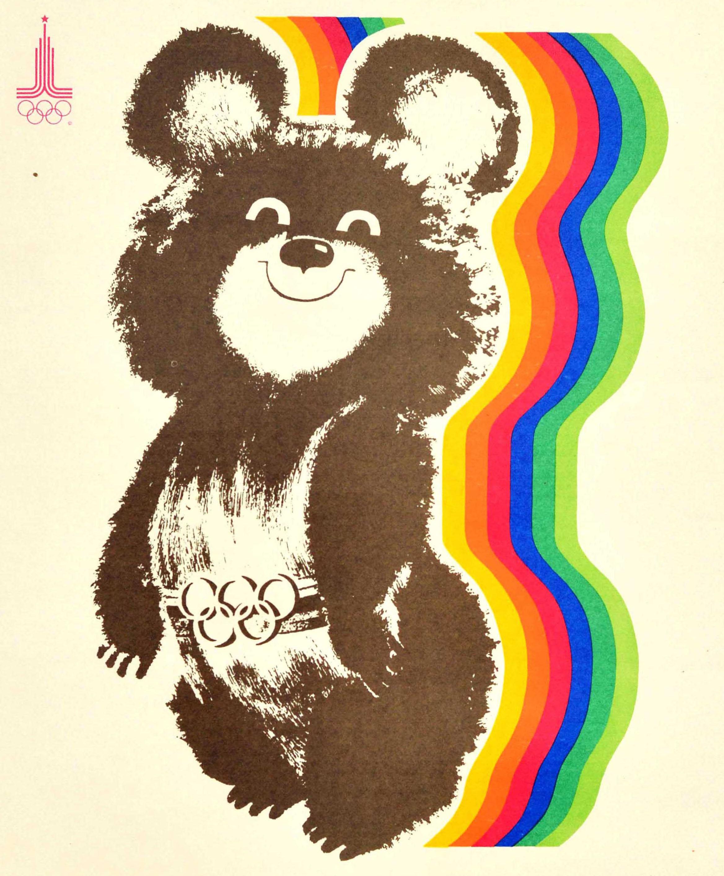 Original vintage Soviet sport poster for the 22nd Summer Olympic Games (Games of the XXII Olympiad) in 1980 held in Moscow Russia featuring a fun and colourful illustration depicting a smiling bear - Misha the Moscow Olympic Games mascot - wearing