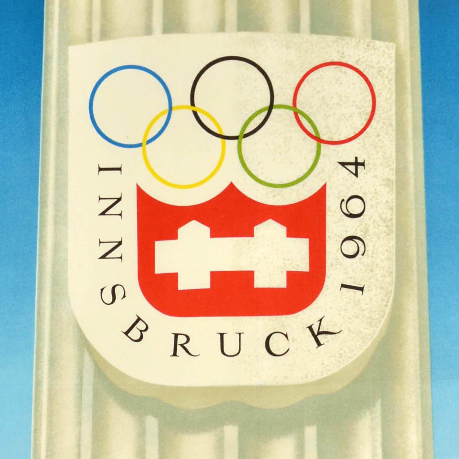 Original vintage sport poster - To the Winter Olympics with Austrian Railways / Zur Winter Olympiade Mit den Osterreichischen Bundesbahnen - featuring an image of the Innsbruck 1964 Winter Olympic Games logo on a column towering above snowy mountain