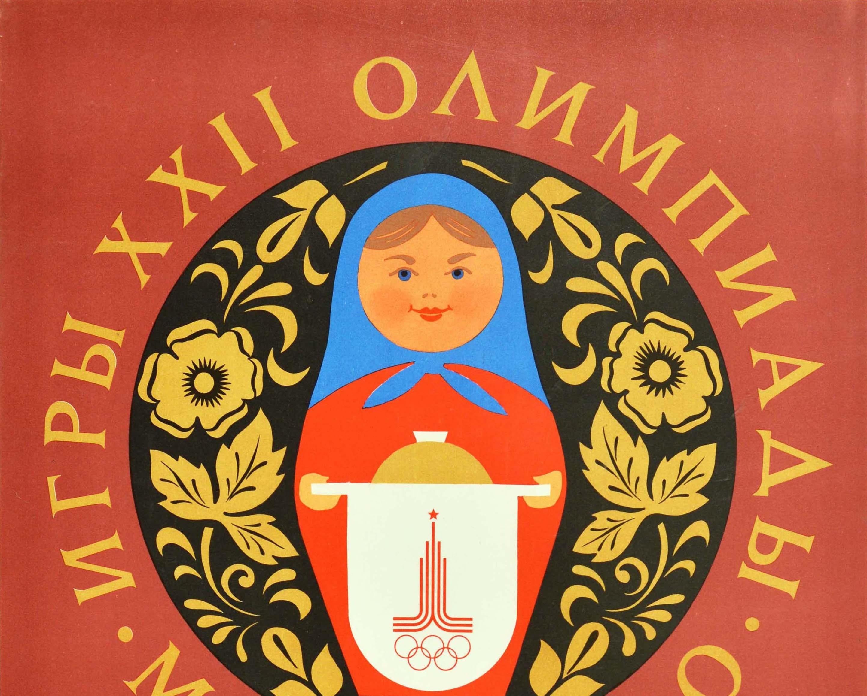 Original vintage Soviet sports poster for the 22nd Summer Olympic Games / Games of the XXII Olympiad in 1980 held in Moscow Russia featuring a great design with a traditional Russian matryoshka doll smiling at the viewer and holding up a loaf of