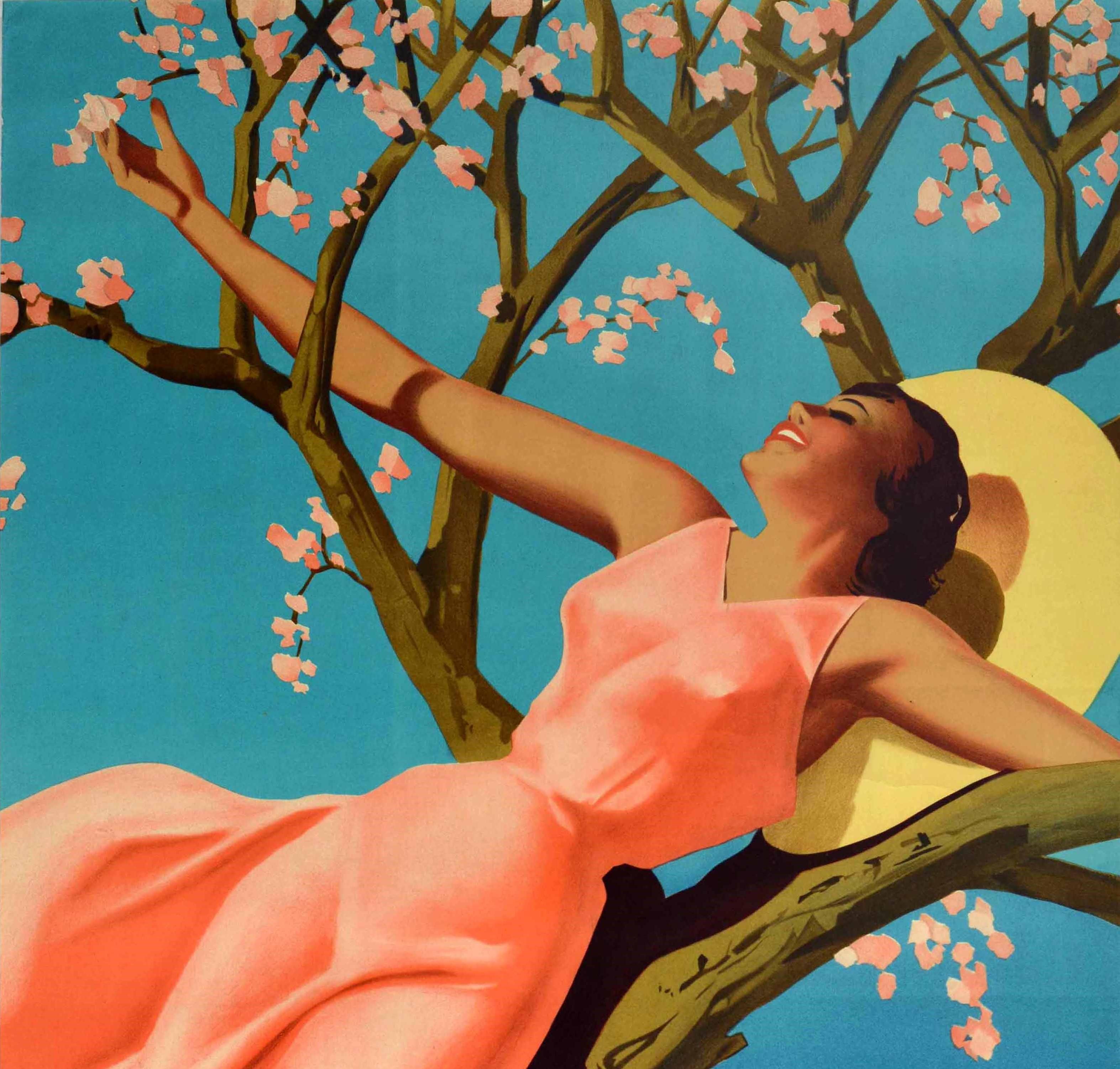 Original vintage travel poster for Lugano Suisse Southern Switzerland Schweiz featuring a smiling young lady in a pink sleeveless dress and straw hat resting against a cherry tree with its springtime pink blossom flowers bright against the blue sky