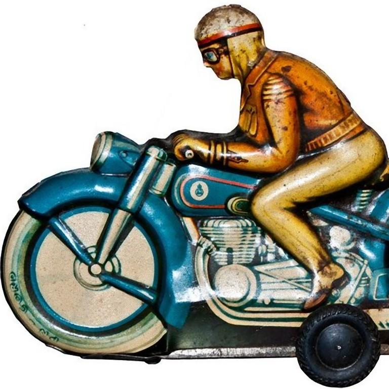This friction motorcyclist is a vintage tin toy.

Vintage friction tin toy representing a motorcyclist on his blue bike.

Made in Western Germany, probably in the 1960s.

Works perfectly, not perfect conditions painting.

This object is