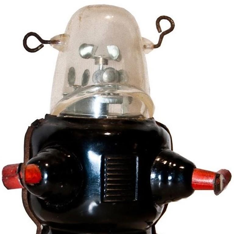 This wind up Robby the robot is a mechanical vintage toy.

Vintage wind up mechanical toy reproducing Robby the Robot Space Trooper. 

1950s version, made in China. After being wind up, it walks forward while the radar spins inside its
