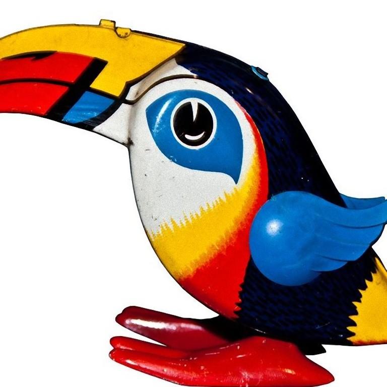 This wind up Toucan is a vintage mechanical toy.

Vintage wind up mechanical toy representing a multi-color jumping toucan.

Made in Gemany by Lehmann between 1968 and 1977. Model n. 945 of Zulu collection.

Clockwork is in perfect working