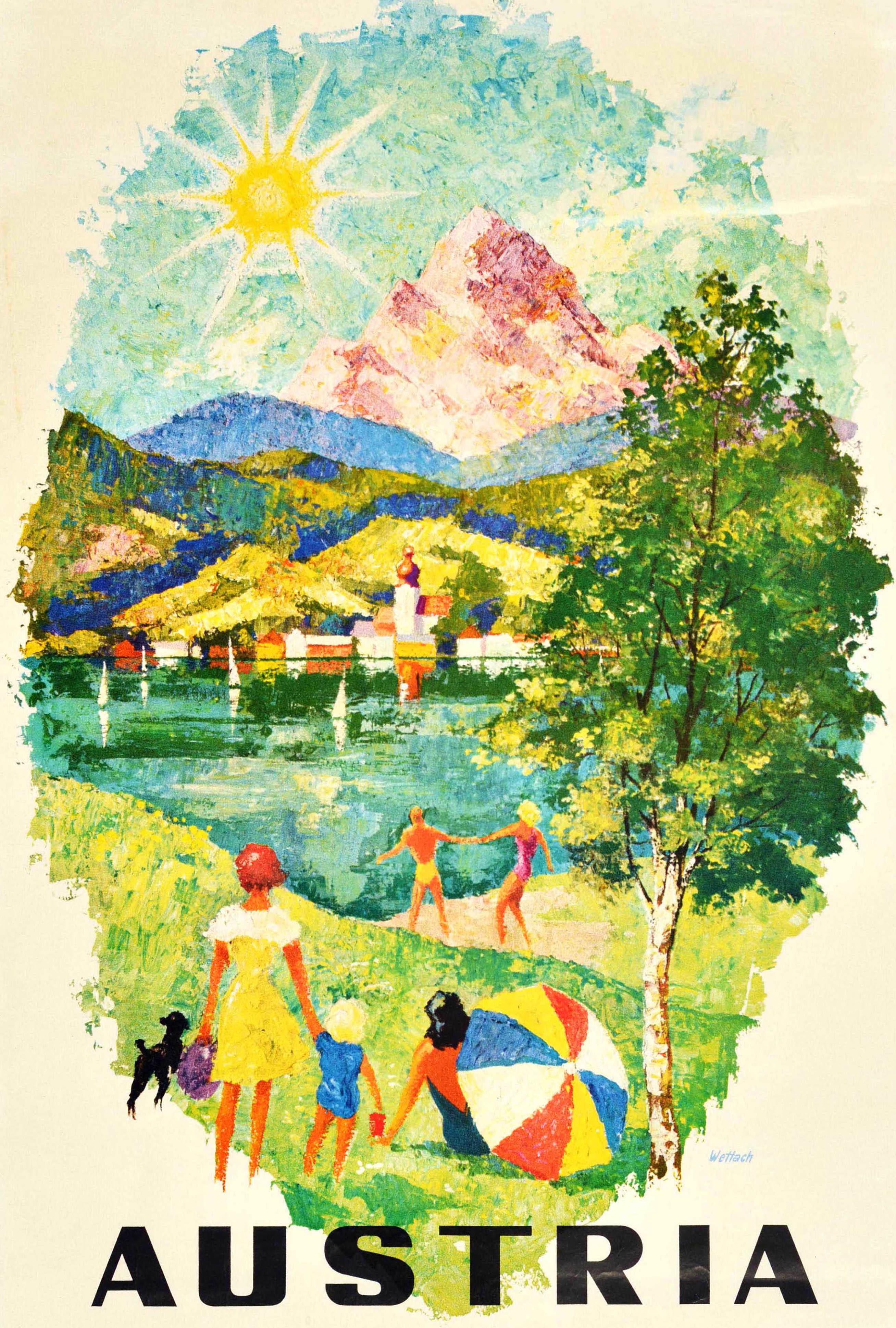 Original vintage travel poster for Austria featuring colourful scenic artwork of people in swimming costumes and a dog in the foreground, with a child holding a bucket, a lady sitting on the grass under the shade of a tree and umbrella, a couple by