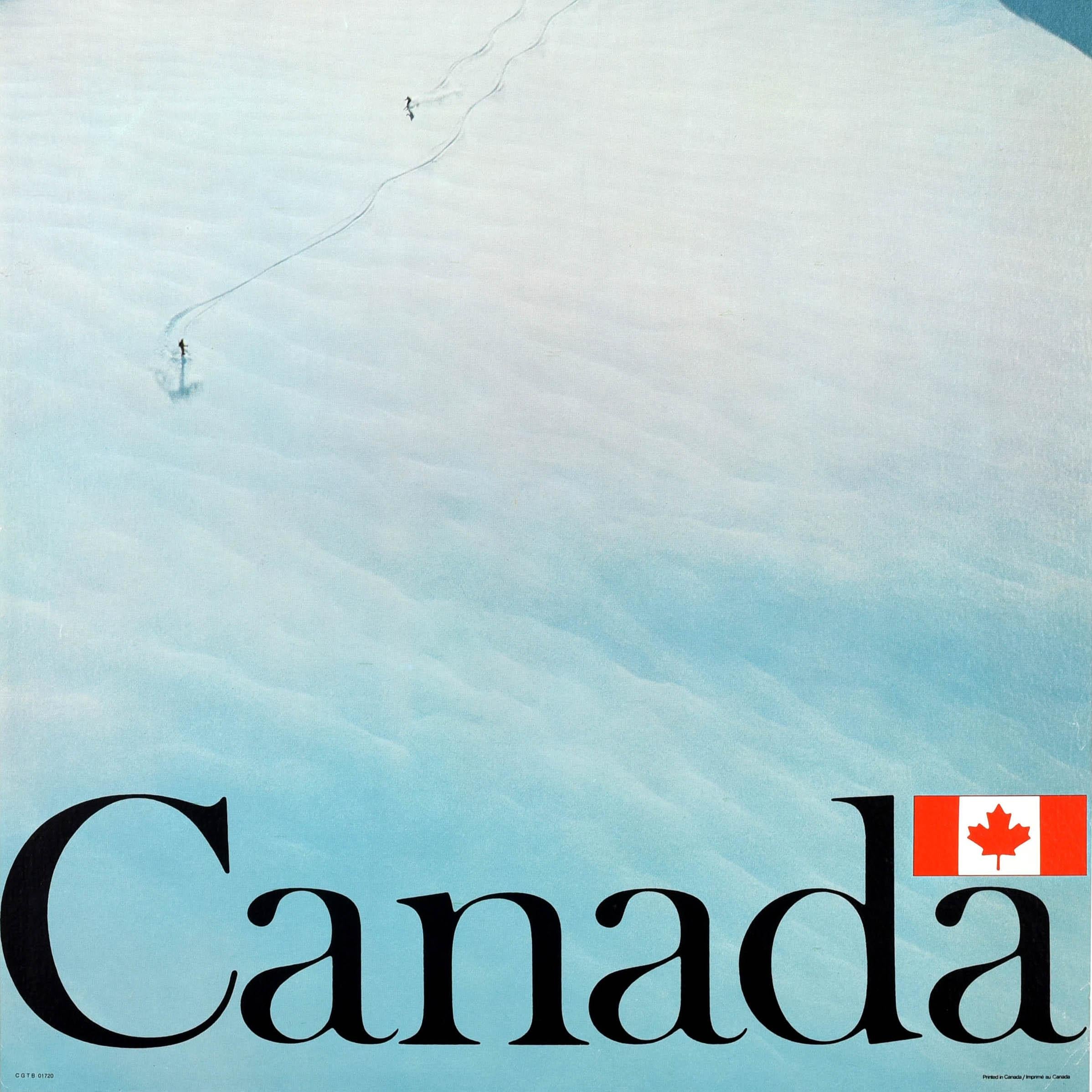 Original vintage ski travel poster for Canada featuring skiers skiing down a mountain slope leaving trails in the snow behind them, the bold black lettering with the maple leaf Canadian flag above the last a below. Very good condition, minor