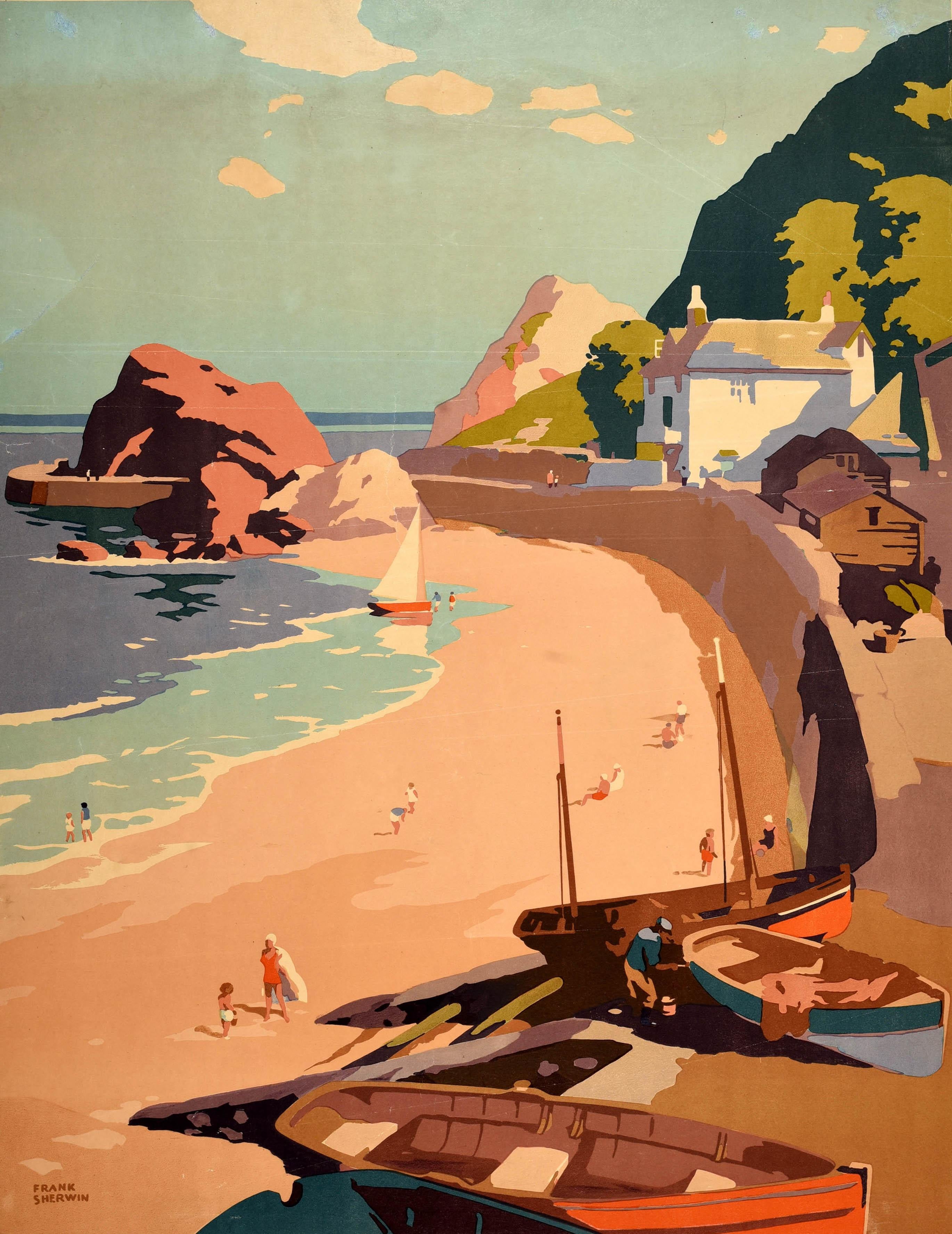 Original vintage railway travel poster for Devon issued by Great Western Railway GWR featuring a great illustration by the notable British poster artist Frank Sherwin (1896-1996) of a beach in Devon with fishing boats in the foreground and a sailing