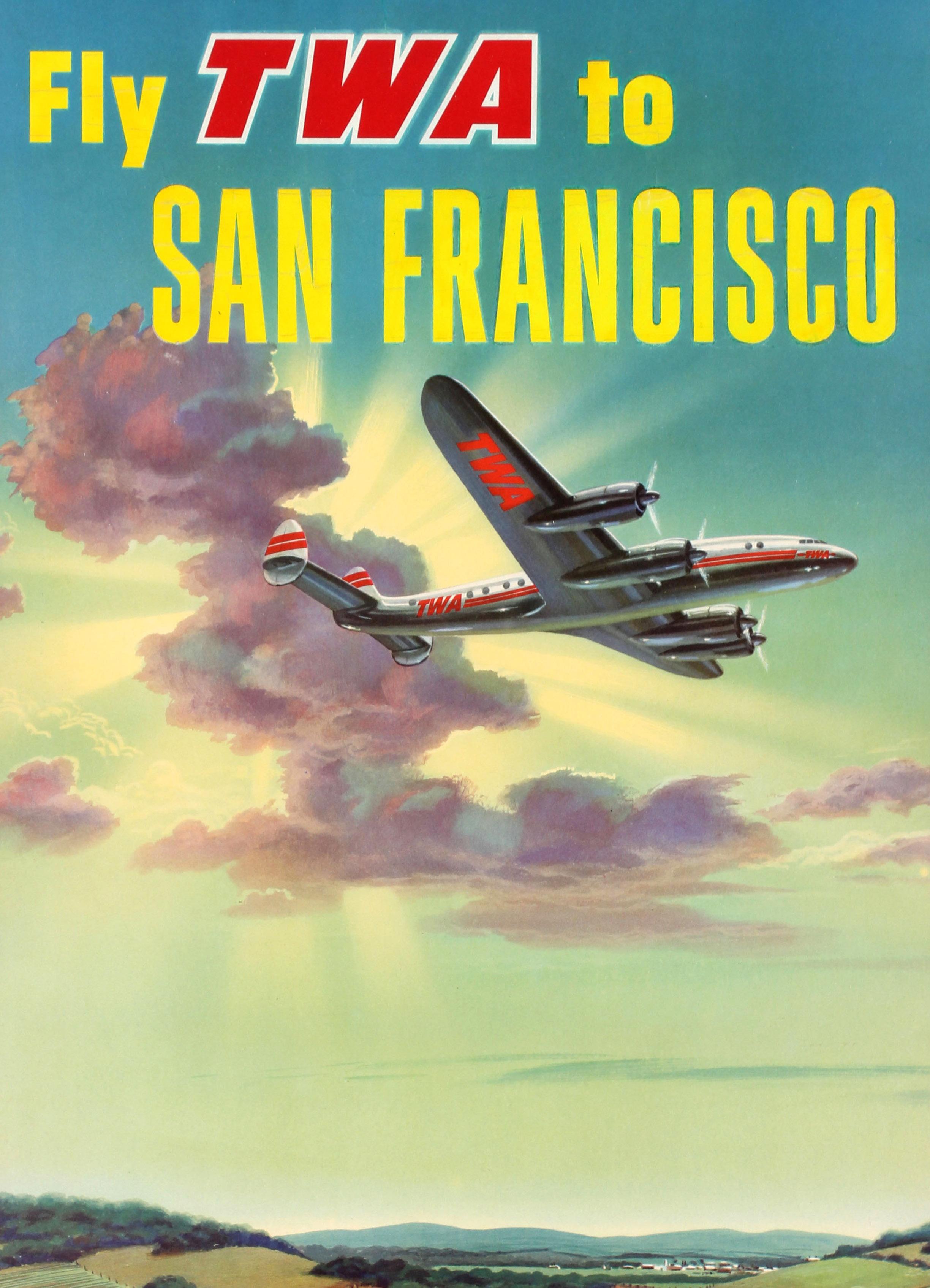 Original vintage travel advertising poster: Fly TWA to San Francisco World-Proved Constellations. Stunning artwork depicting a TWA Lockheed Constellation plane flying over the countryside with a burst of sunshine dramatically lighting up the image