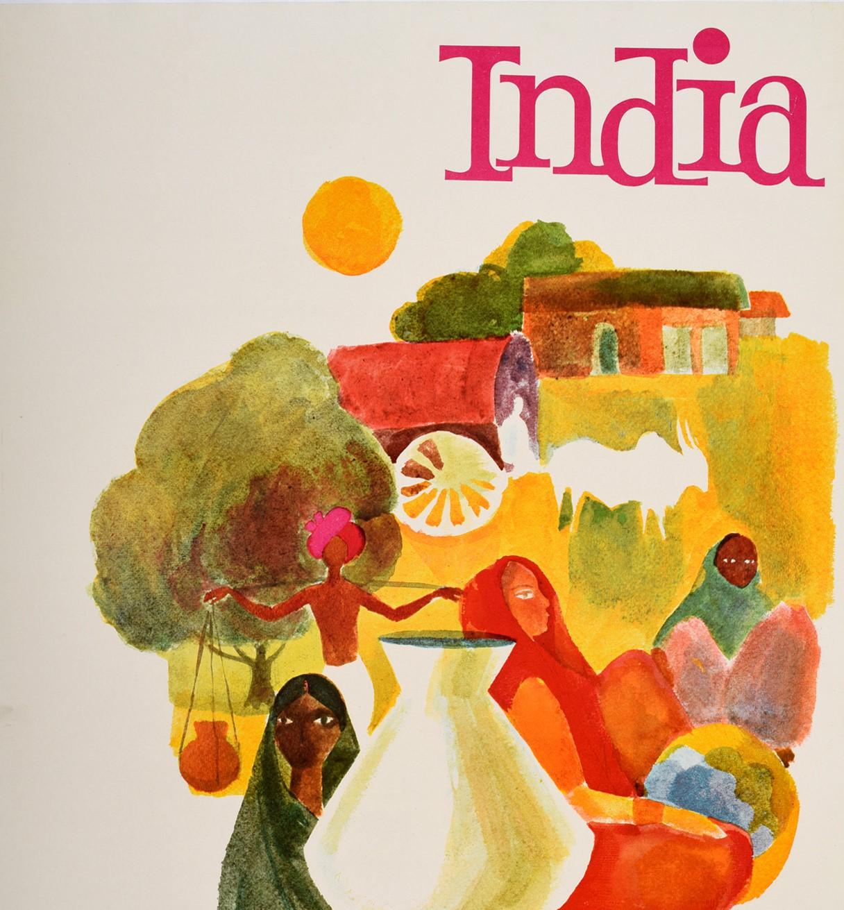 Original vintage travel poster for India featuring a colourful image of people in the countryside with a lady wearing a traditional colourful dress carrying a pot on her head in front of a cow lying down and more people behind her, a cart passing