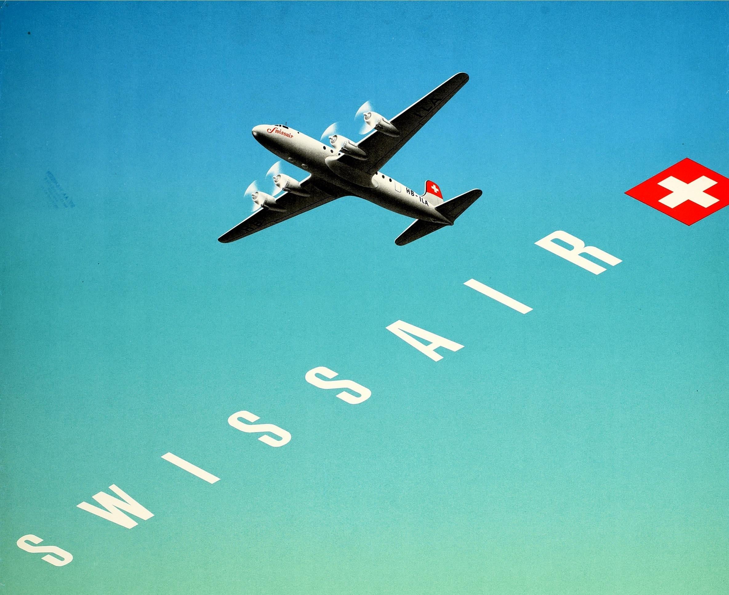 Original vintage travel advertising poster for Swissair featuring a fantastic illustration of a propeller plane flying high over the Swiss Alps with a red and white cross Swiss flag and the title text in bold white lettering running diagonally below