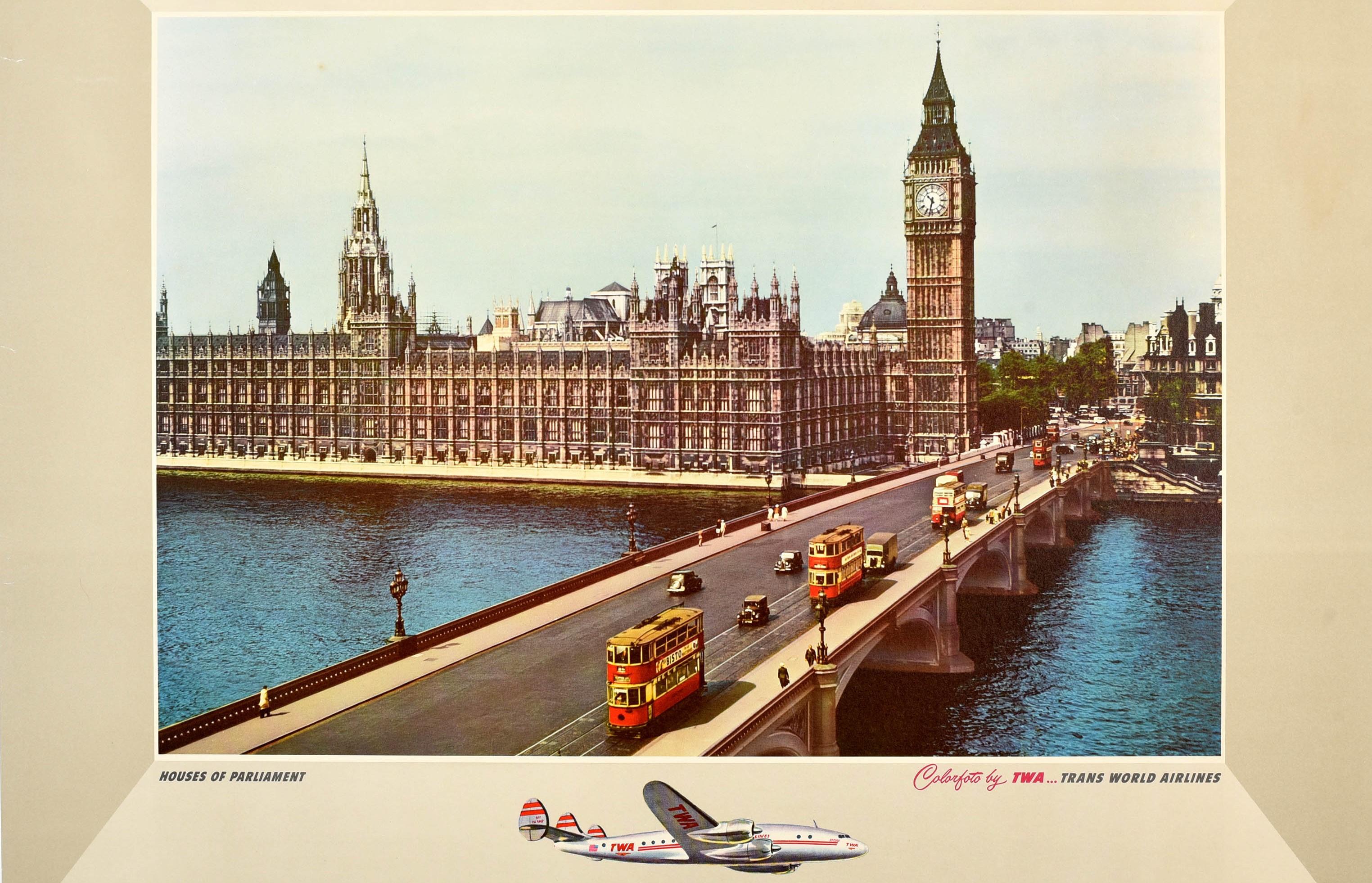 Original vintage airline travel poster - Along the way of TWA... England Houses of Parliament - featuring a colour photograph depicting people walking and trams and cars driving over Westminster Bridge in front of the Houses of Parliament and the