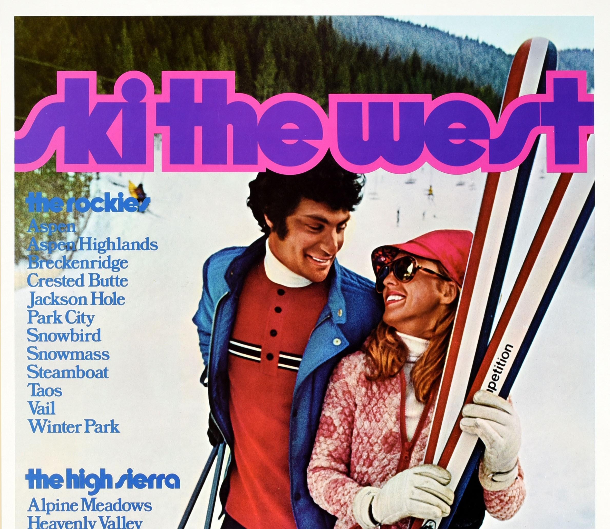 Original vintage winter sport skiing travel poster - Ski The West United Air Lines - featuring a photo of a smiling couple standing in the snow in front of trees and mountains, the lady holding a pair of skis and the man leaning on the poles, the