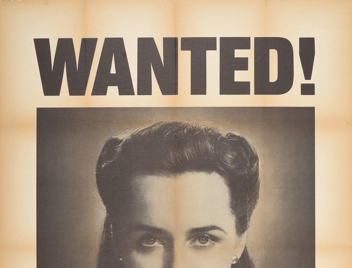 Original vintage World War Two propaganda poster - Wanted! For murder Her careless talk costs lives - featuring a black and white photo of a lady looking at the viewer with the bold black text above and below, the warning text against careless talk