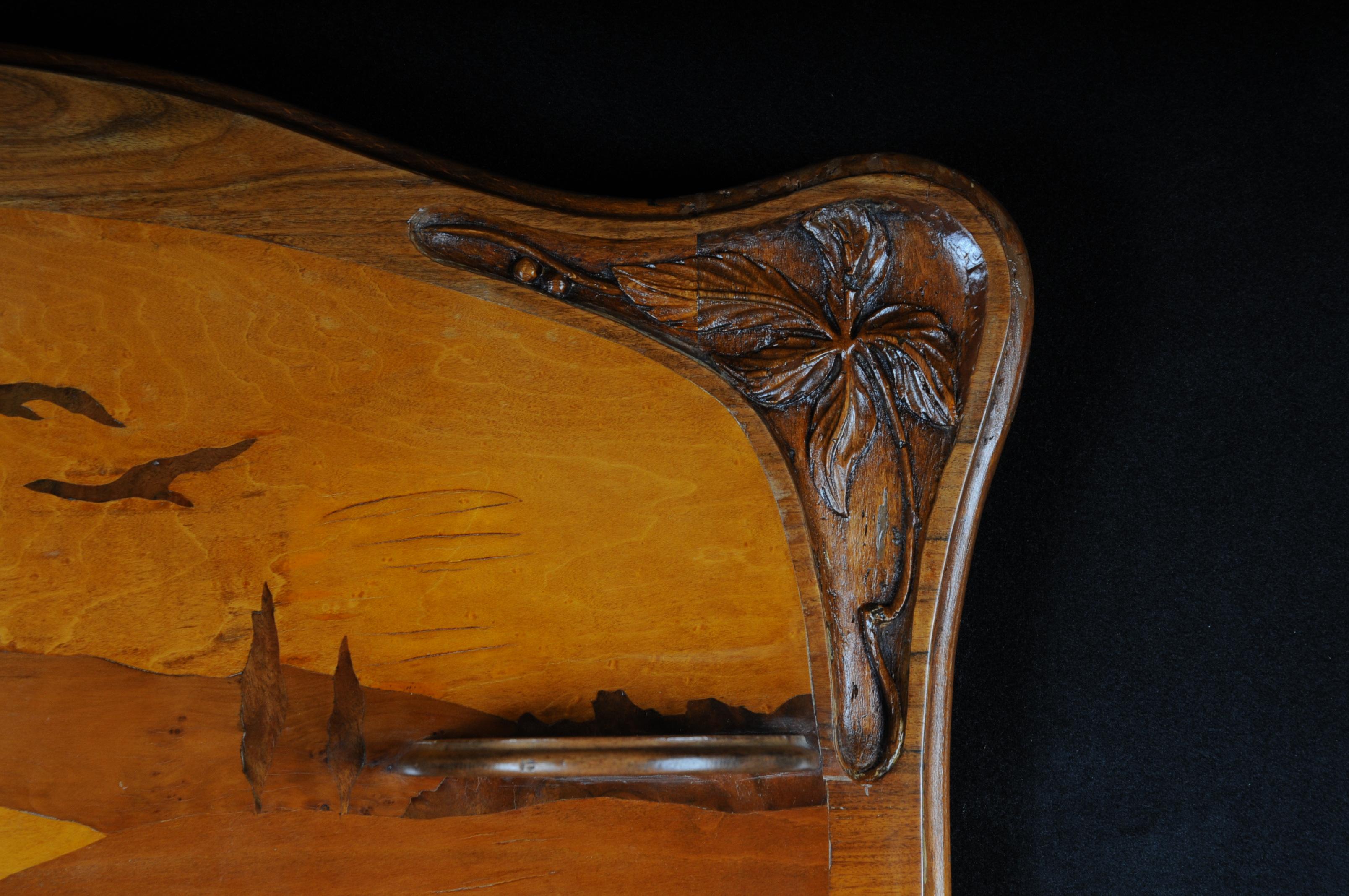 Original wall shelf Emile Galle Art Nouveau, circa 1900
Shield-shaped, inlaid mural created by Emile Galle with a landscape motif of different precious woods.
Signed: Emile Gallé. Extremely rare wall shelf from the Art Nouveau period.

(V-154).