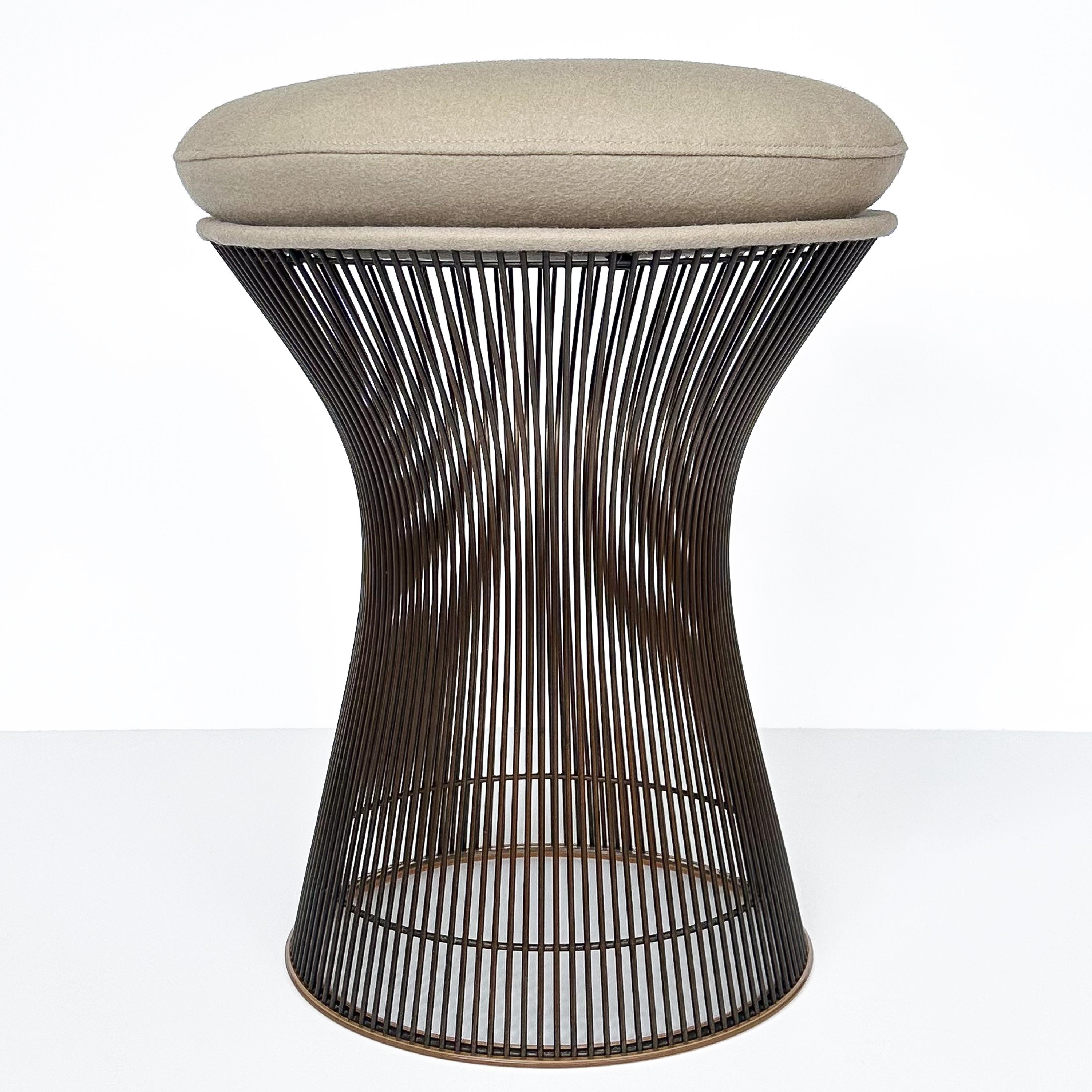 An original 1960s production Warren Platner bronze stool for Knoll.  Early and rare bronze finish.  Newly upholstered seat in a Kvadrat / Davina wool felt fabric.  The fabric is stone / putty color.  Original Knoll Associates label from the 1960s