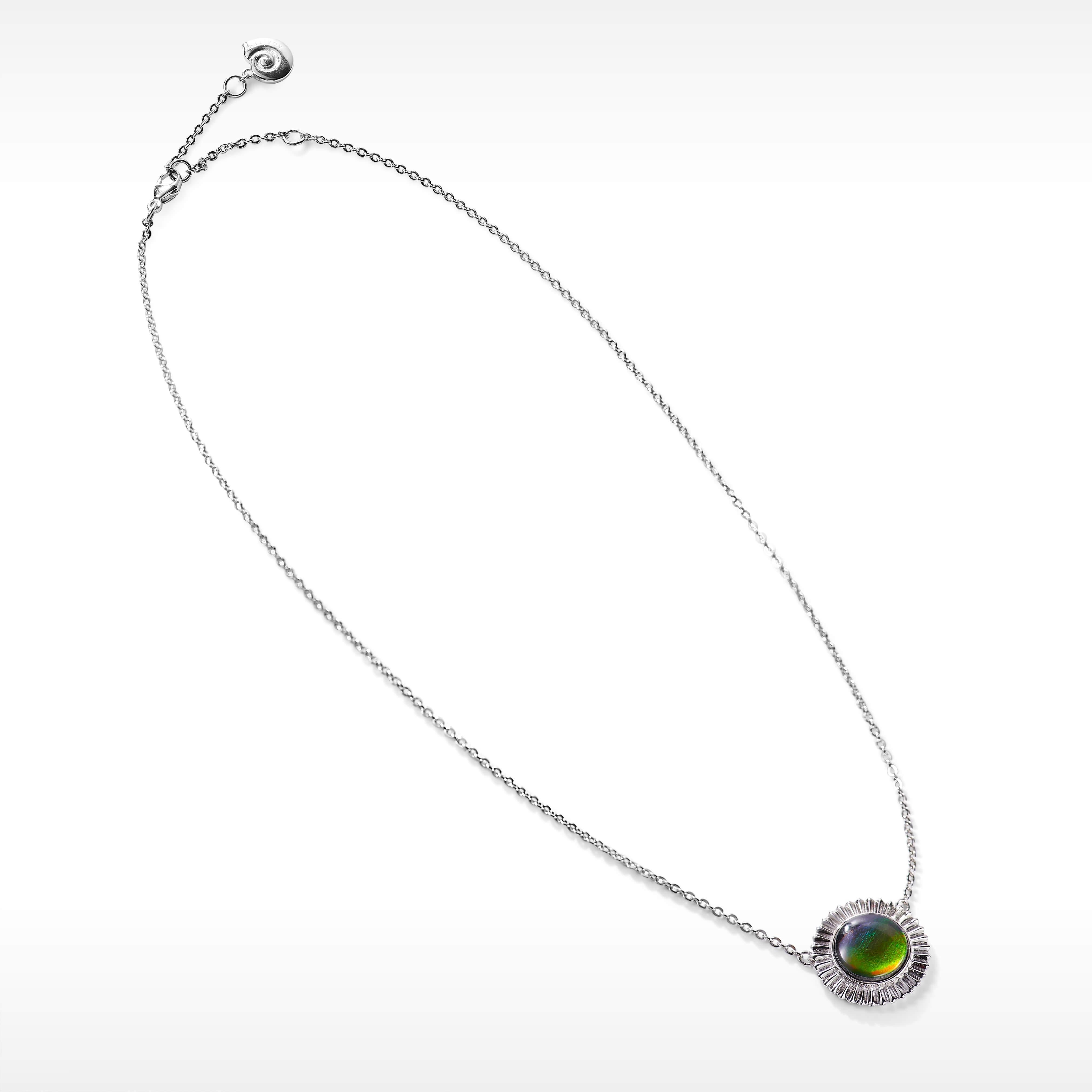 Product Details:

The Origins collection features bold Ammolite showpieces highlighting organic textures inspired by our ammonite roots.

A grade Ammolite
11mm round Ammolite pendant
925 Sterling Silver
Pendant Dimensions: 18.2mm x 18.2mm.
Chain