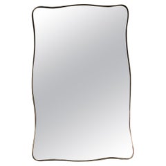 Orignal Italian 1950s brass shield mirror in the style of Gio Ponti