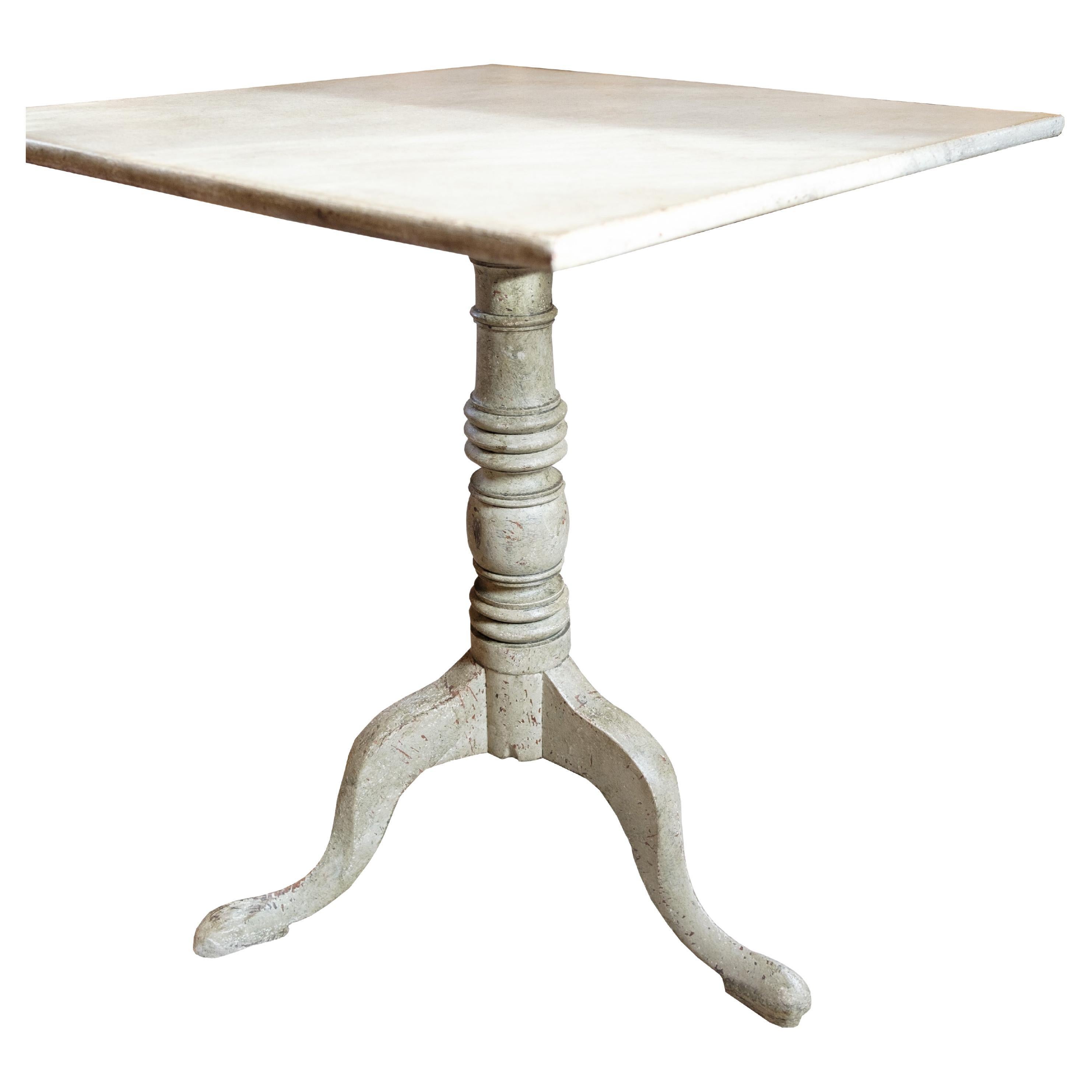 Beautiful antique column/side table with natural original paint. They appear with 3 legs and round column. The table has a folding function, which makes it more functional. Very simple minimalist design game table from the 1840s. Rarely seen in such