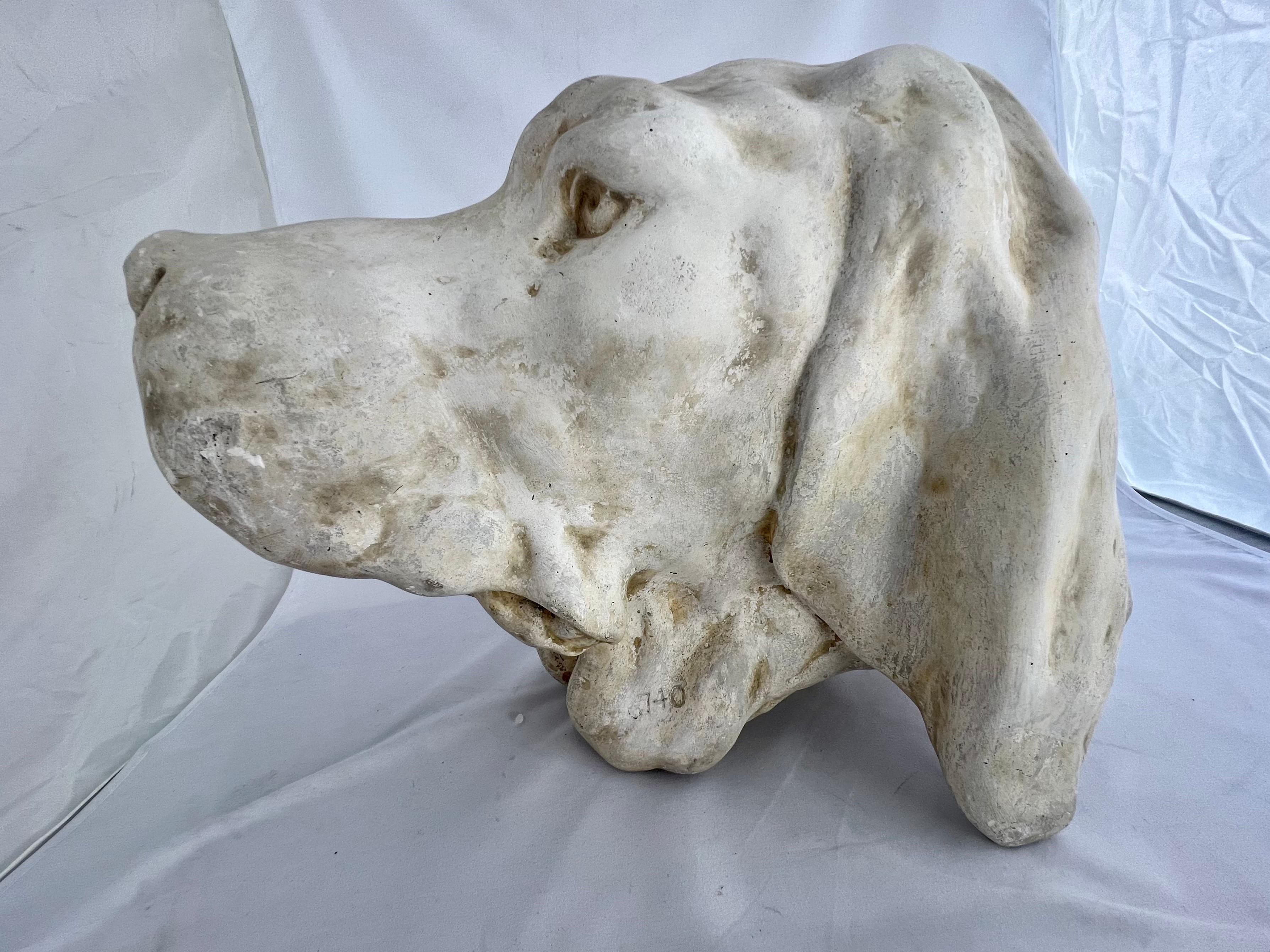 A plaster casting of a Pointer dog by the Caproni Bros. The brass hallmark on the back dates it to the beginning of the 20th century when the company was still young and growing. They made accurate castings from pieces they found in Europe and made