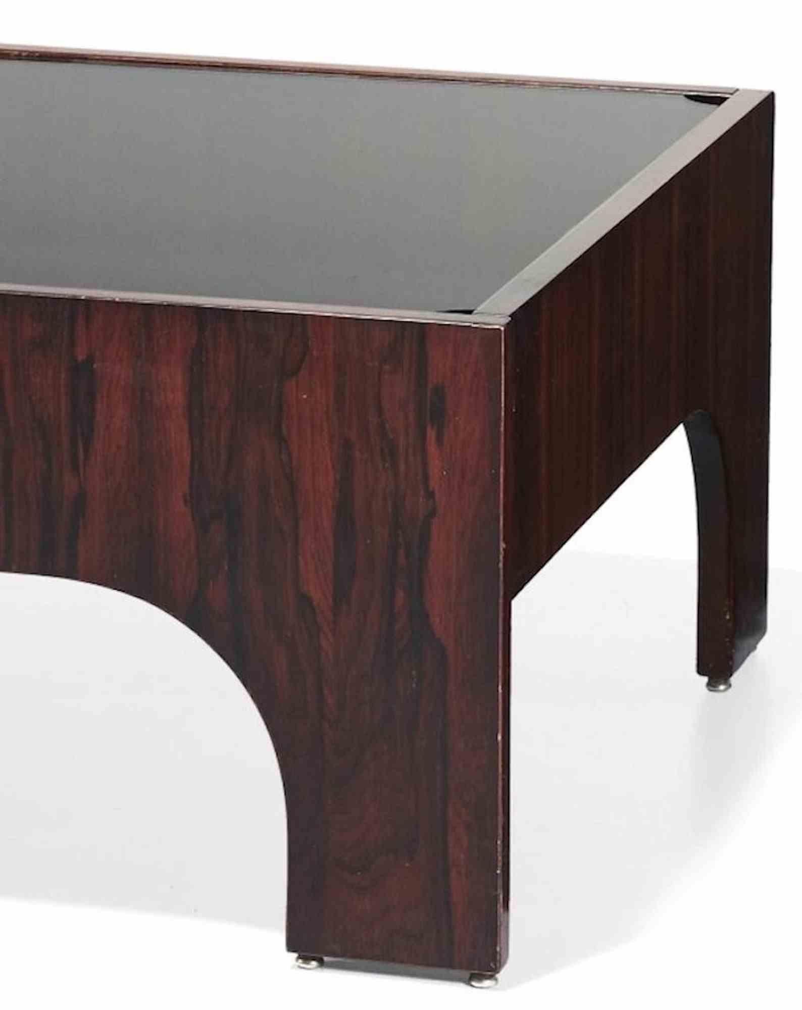 This Oriolo Coffee Table for Sormani was realized around 1960s by the Italian designer Claudio Salocchi ( 1934-2012).

Composed by a removable glass surface and a rosewood structure.

Dimension: 42 x 83 x 83 cm.

Very good condition.

