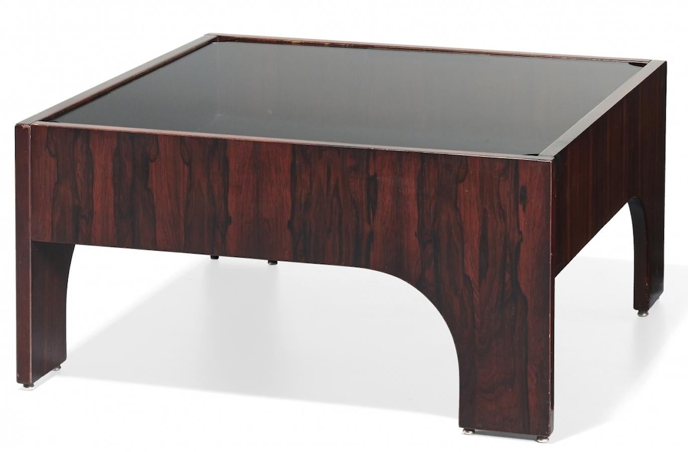This Oriolo coffee table for Sormani was realized circa 1960s by the Italian designer Claudio Salocchi, (1934-2012).

Composed by a removable glass surface and a rosewood structure.

Dimensions: 42 x 83 x 83 cm.

Excellent condition.