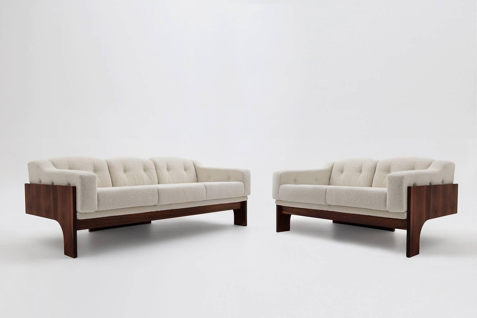 Oriolo sofa set by Claudio Salocchi for Sormani, Italy 1966.
Exceptional design made out of fine Brazilian Rosewood with a beautiful warm woodgrain. All fully restored; cushions are reupholstered with a off white Bouclé fabric from the collection of