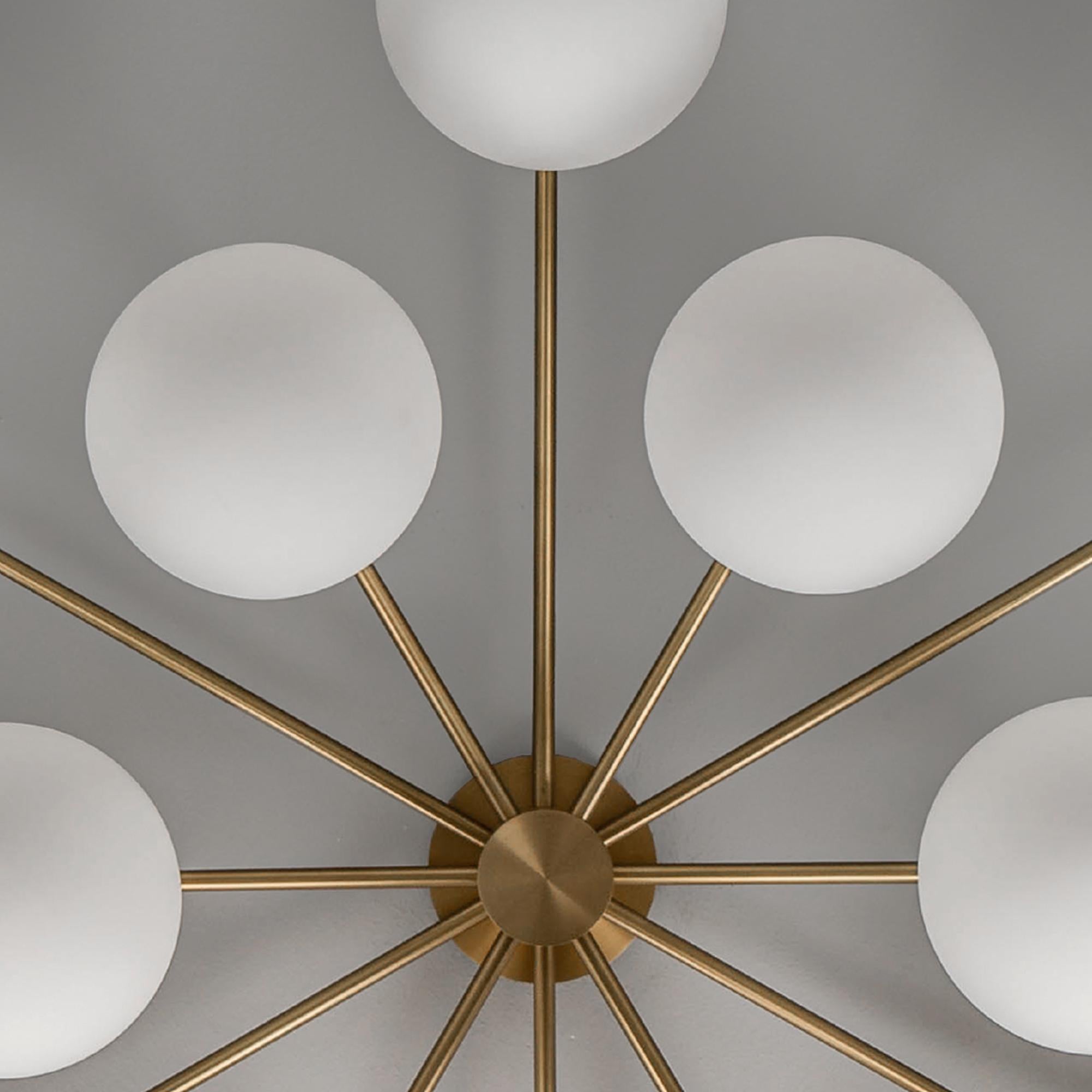 The crystalline clarity of the translucent sphere gifts a spontaneous, ethereal quality, aided by unassuming brass ceiling fixtures.

Available in our three signature finishes: Lacquered Burnished Brass (LBB); Black Gunmetal (BGM); Polished Nickel