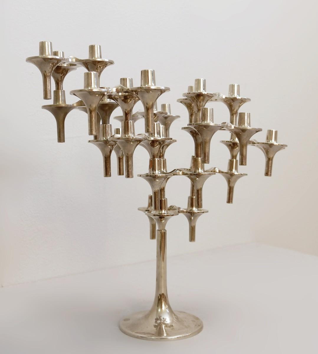 Fritz Nagel & Ceasar Stoffi set of 12 modular candleholders 'Orion' by BMF - 1960 Measurements are variable depending on the arrangement of the elements Measure 1 piece Ø 10 - h 6 cm Base + 3 pieces: l 16 - h 25 cm.