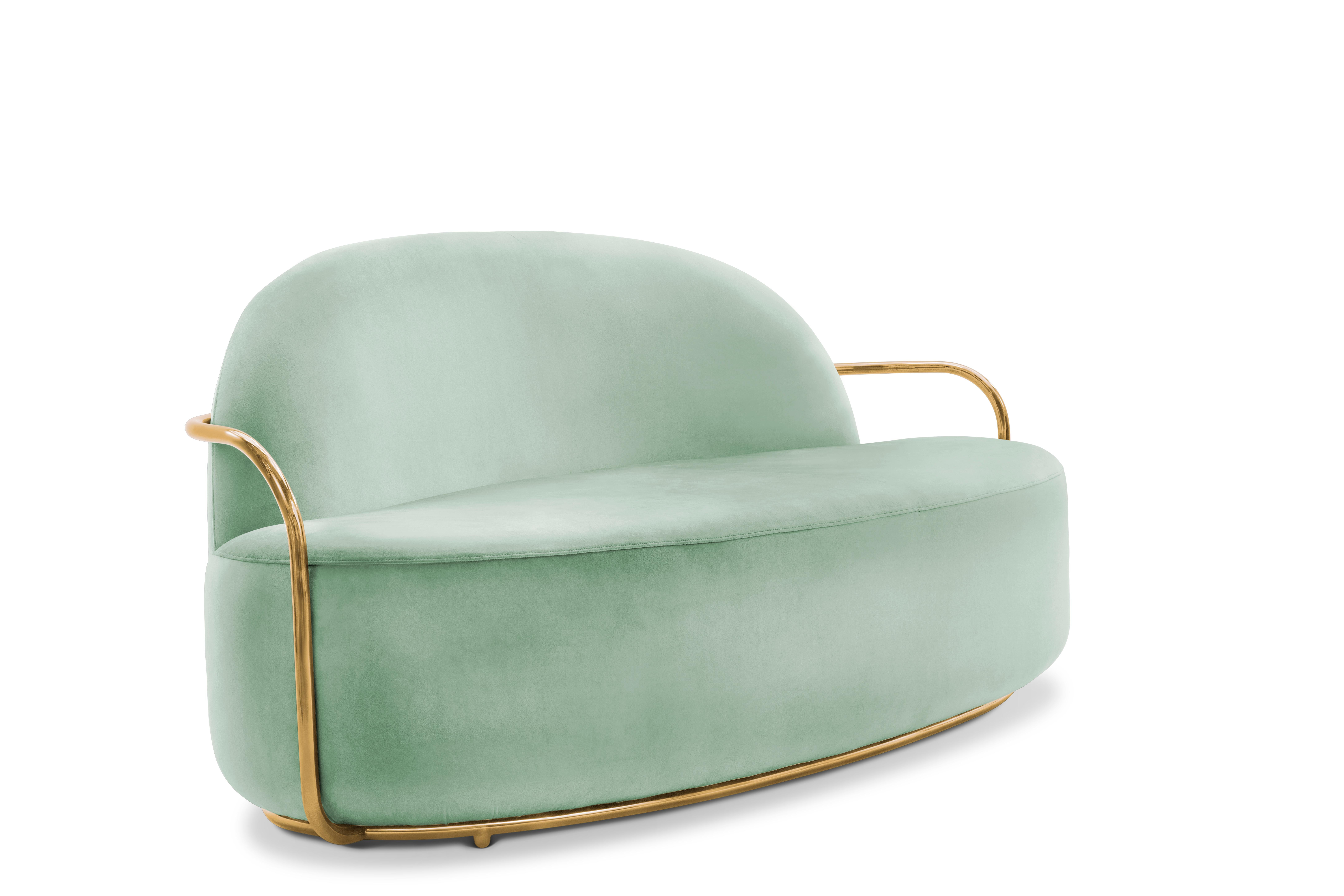 The comfort of Orion 3 Seat Sofa with Plush Mint Green Velvet and Gold Arms by Nika Zupanc compliments the cool mint green velvet and gold metal arms.

Nika Zupanc, a strikingly renowned Slovenian designer, never shies away from redefining the
