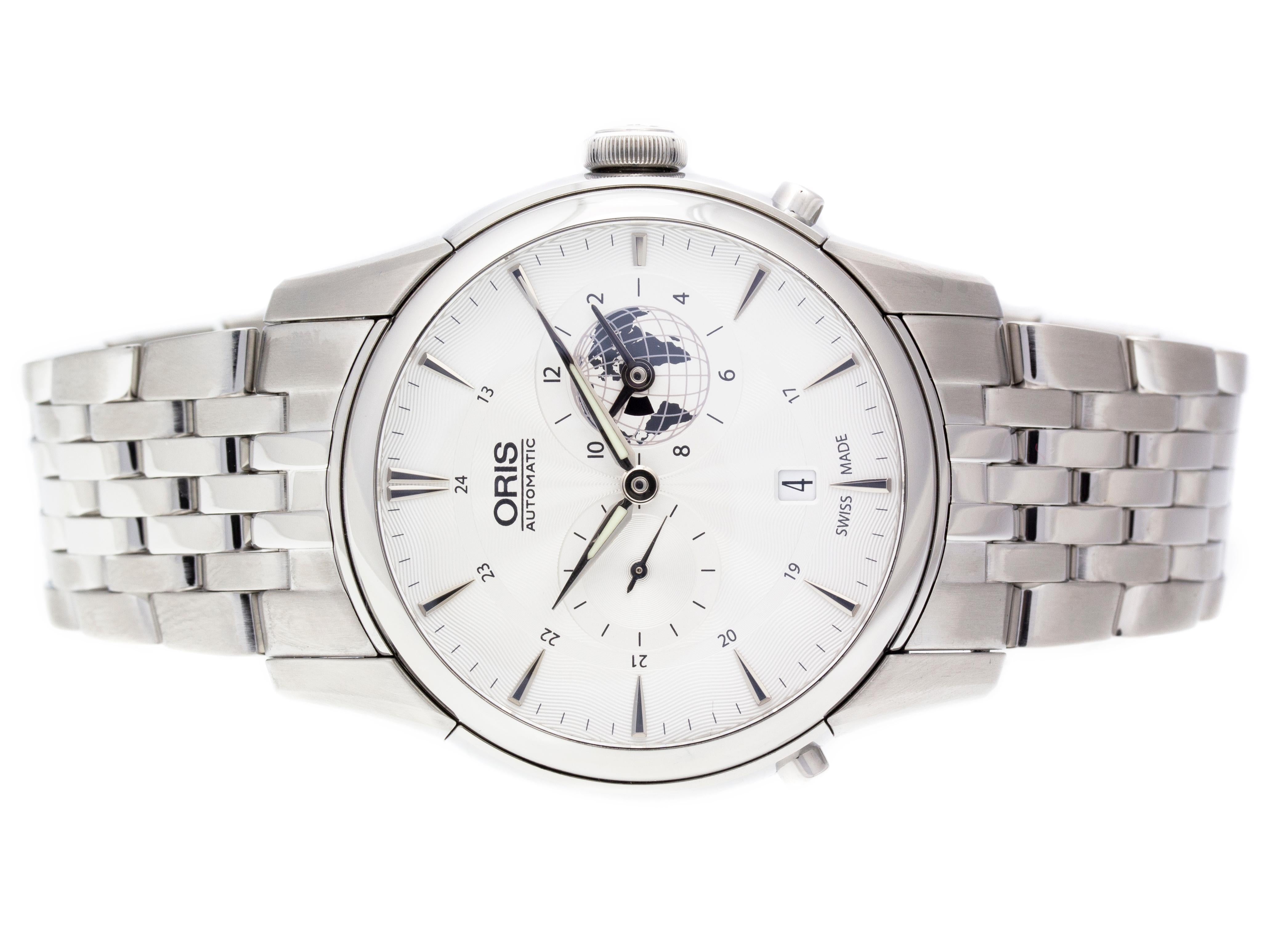 Stainless Steel Oris Artelier Greenwich Mean Time Limited Edition Automatic Watch with a 42mm case, White dial, and Stainless Steel Bracelet with Deployment Buckle. Features include Hours, Minutes, and Date at 6 o'clock, and Dual Time Zone. Water