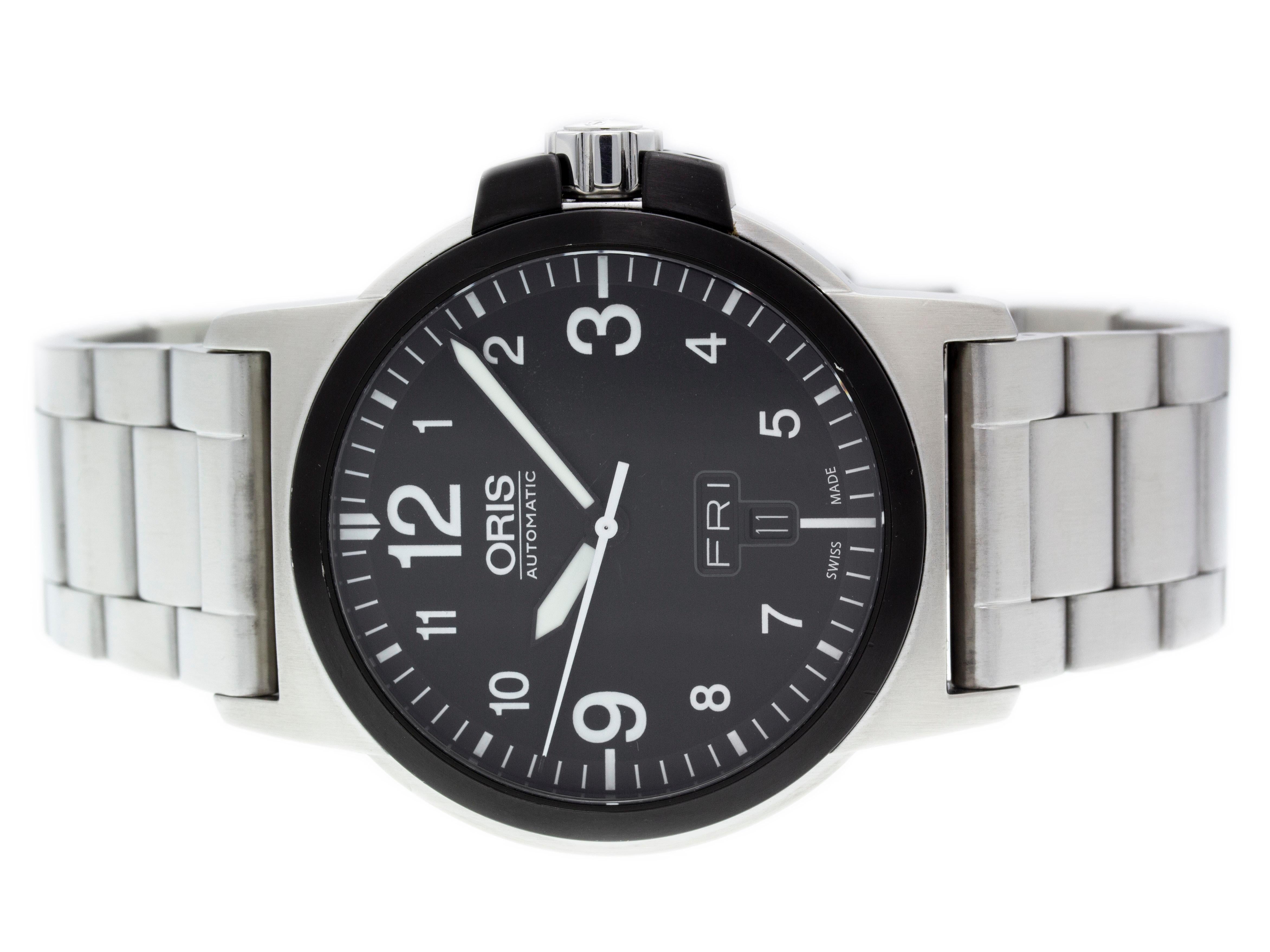 Stainless steel Oris BC3 Advanced automatic watch with a 42mm case, black dial, and steel bracelet with folding clasp. Features include hours, minutes, seconds, day, and date. Comes with a Deluxe Gift Box and 2 Year Store