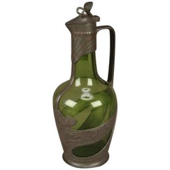Orivit, decantador Art Nouveau de peltre y vidrio verde, diseño número 1211
