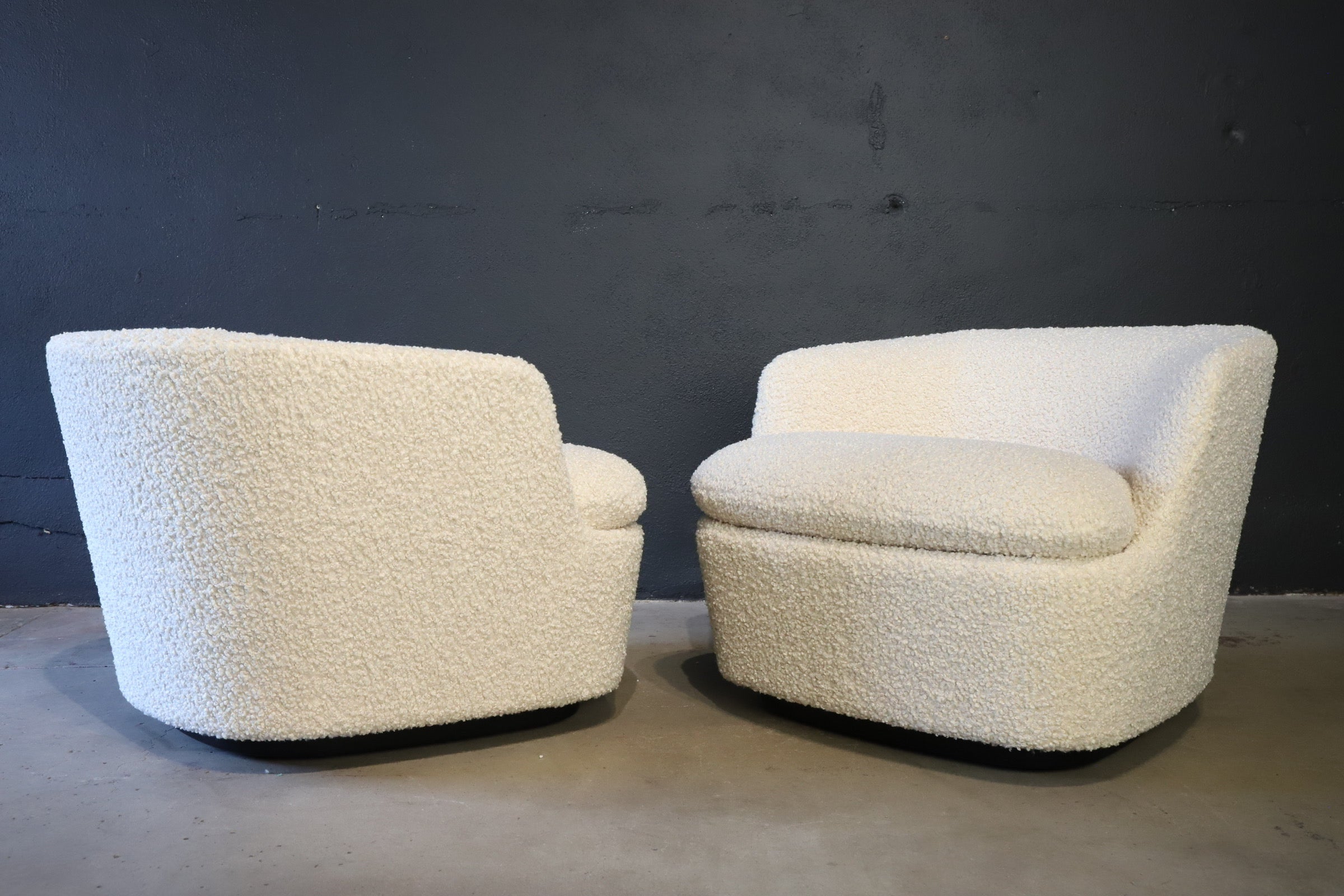 Stunning modern and contemporary stylish lounge chairs by Jasper Morrison for Cappellini. Custom nubby upholstery makes the chairs feel like a gentle soft hug while seated. Both chairs feature a 360 degree swivel. Chairs photographed with waterfall