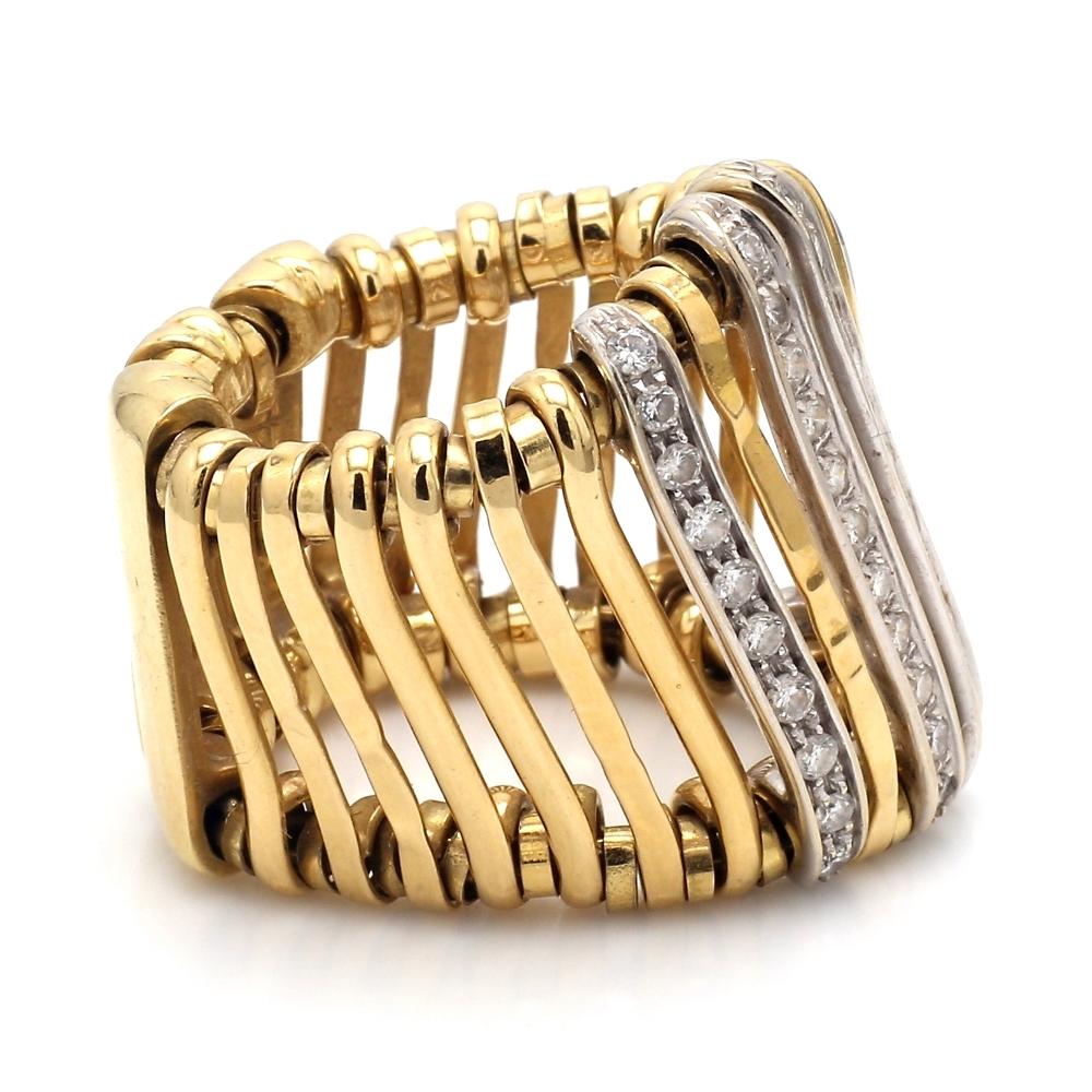 Orlando Orlandini, 18K yellow and white gold, flexible band. Band is set with forty-one (41) round brilliant cut diamonds weighing approximately 0.88ctw. Ring weighs 22.0 grams and is a size 7.5. 
All questions answered.
All reasonable offers are