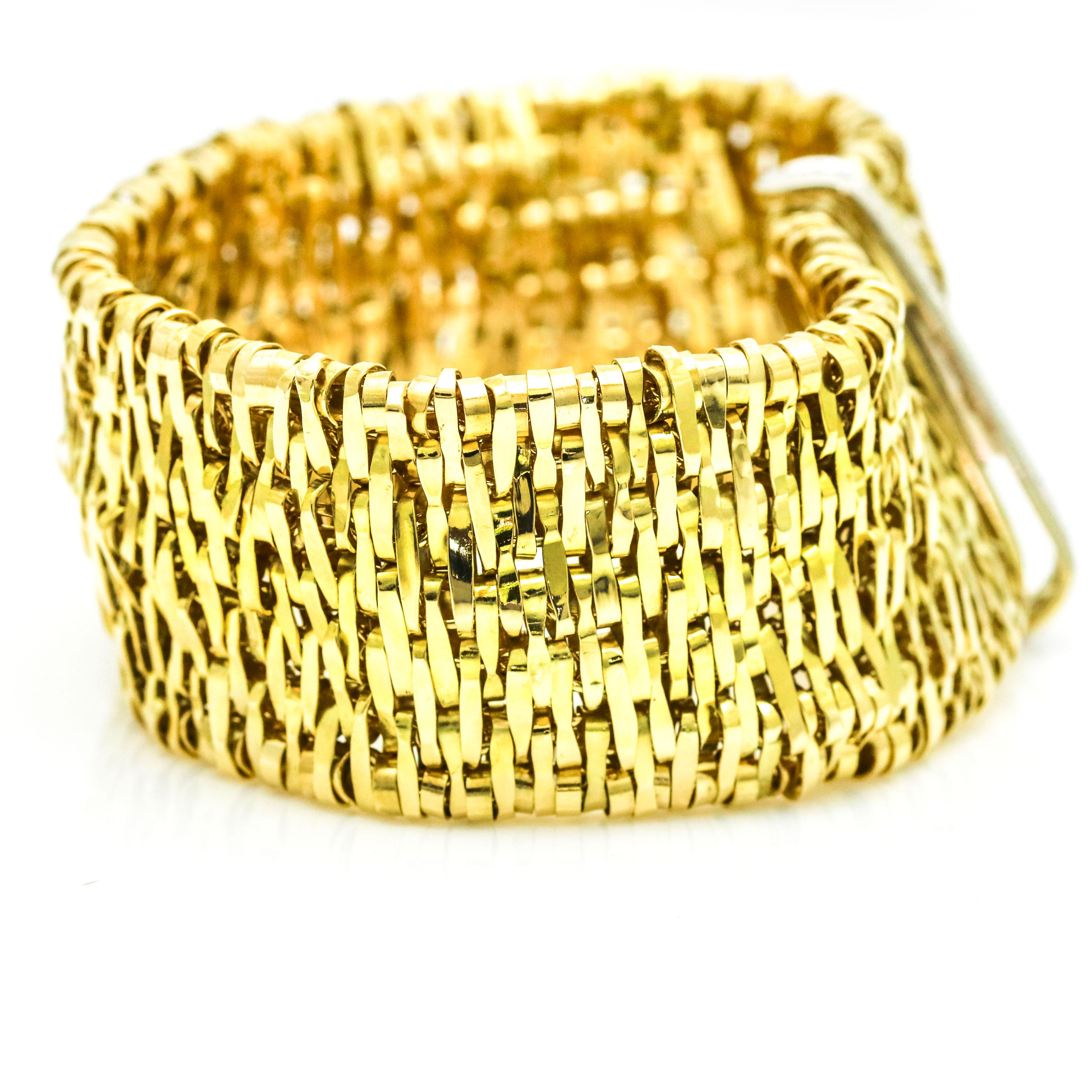 Orlando Orlandini Fiandra wide woven link bracelet crafted in 18 karat yellow gold with diamonds on clasp. The small woven links make this bracelet flexible. The metal is high polish and feels soft on the skin. Push clasp with a safety. 
