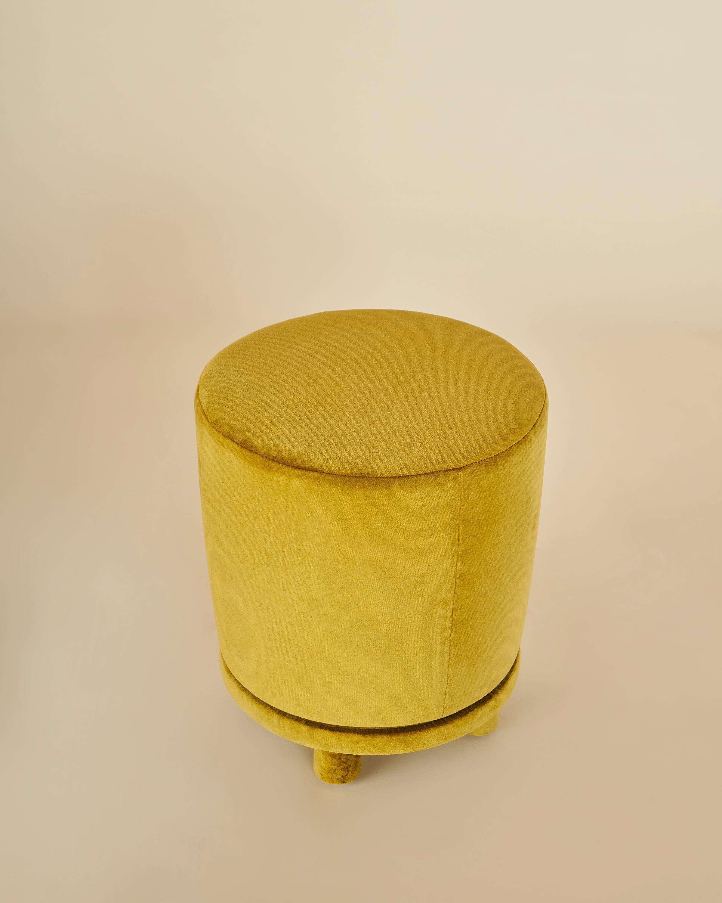 This versatile and elegant ottoman is tapered and simplistic in form. The piece boasts fully upholstered legs, which add dimension and elevates the design from head to toe. 

Shown in turmeric velvet. 