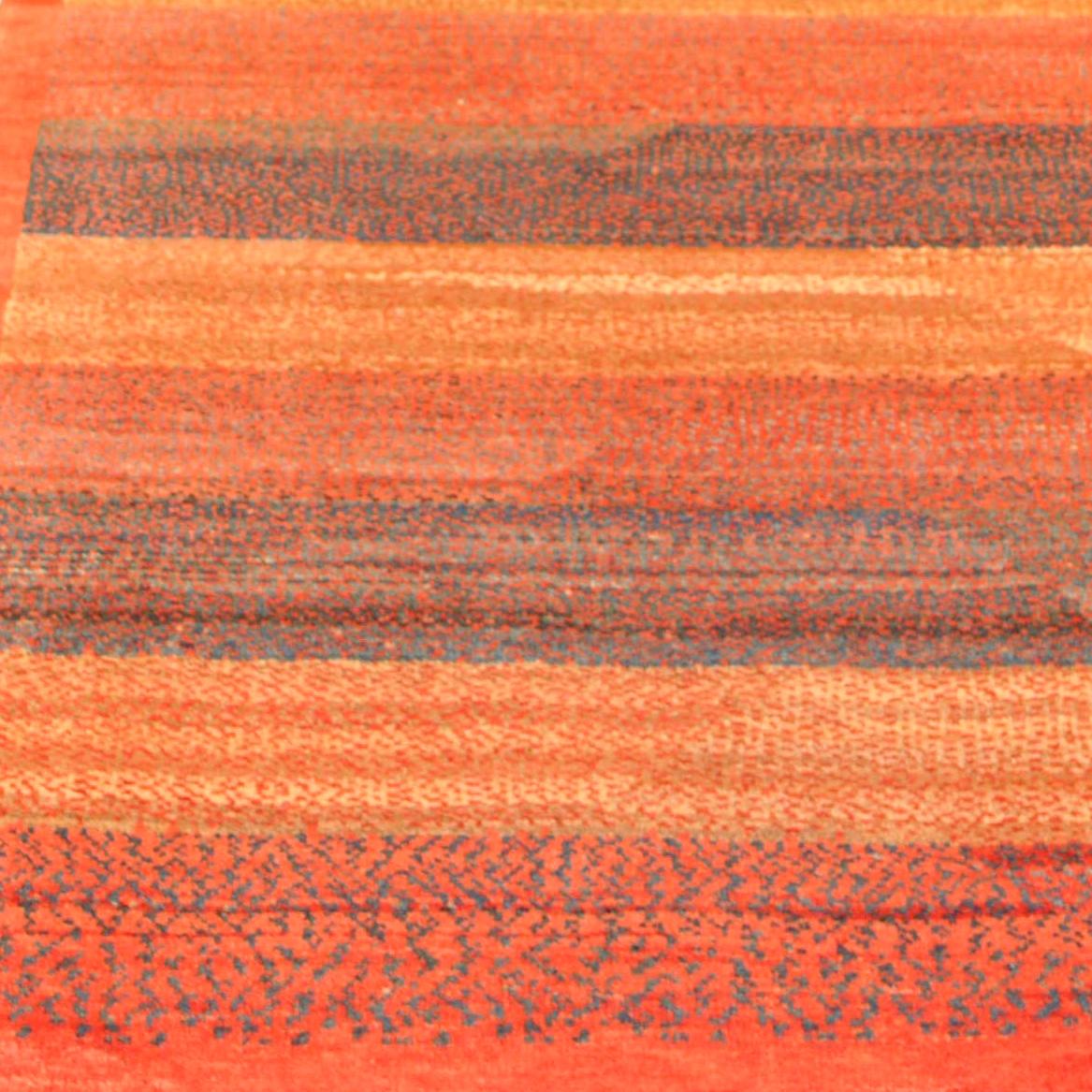 This Orley Shabahang signature “Color Bands” carpet in pure handspun wool and organic dyes showcases a contemporary design in a hand knotted Persian weave. Utilizing only primary colors, red, blue, and yellow combine in a small-scale pointillism to