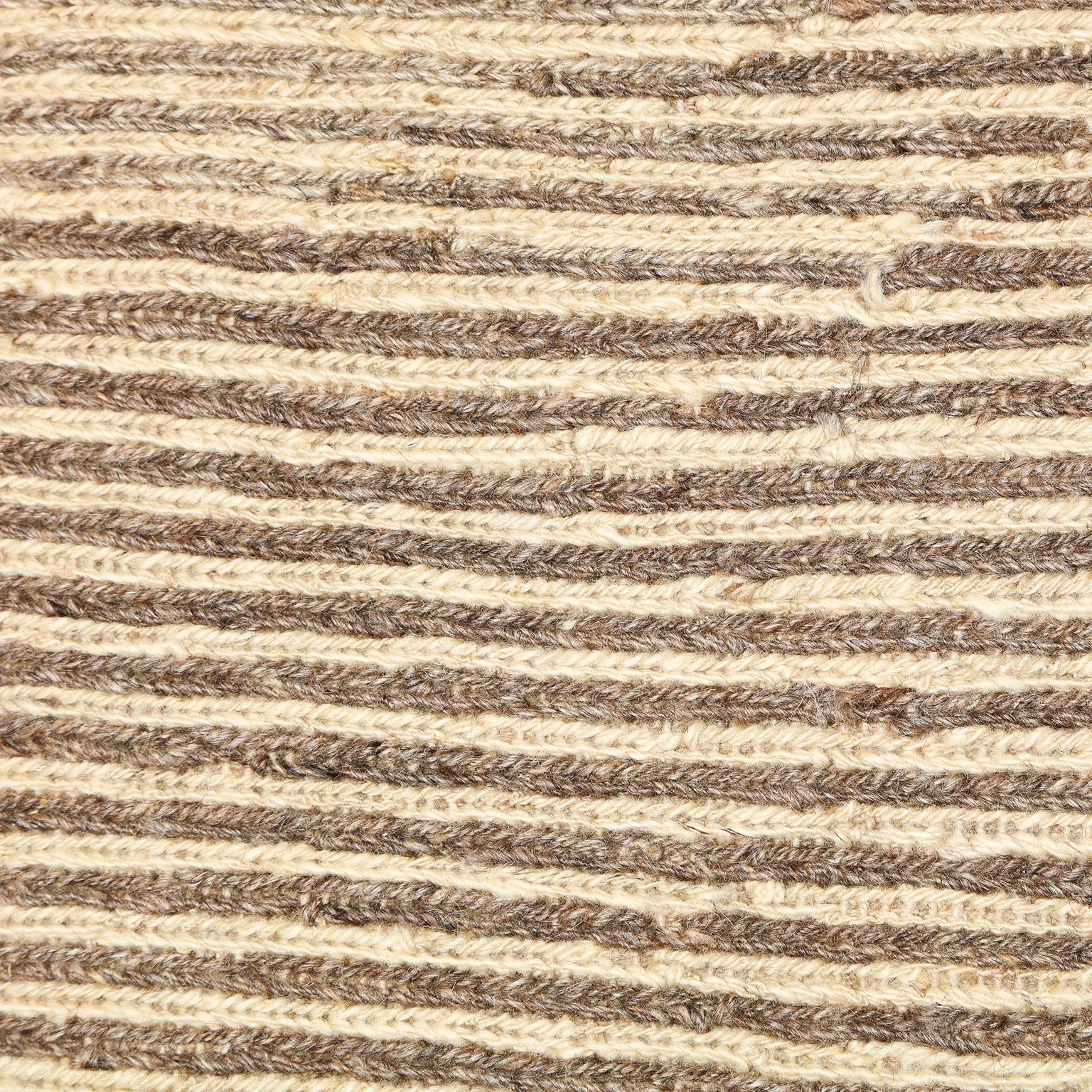 This tan, camel, brown, and cream Persian flat-weave uses ancient Persian weaving techniques that are rarely seen in flat-weave Persian carpets. The overall effect of the warm and neutral colors creates an overall impression that brings life to a