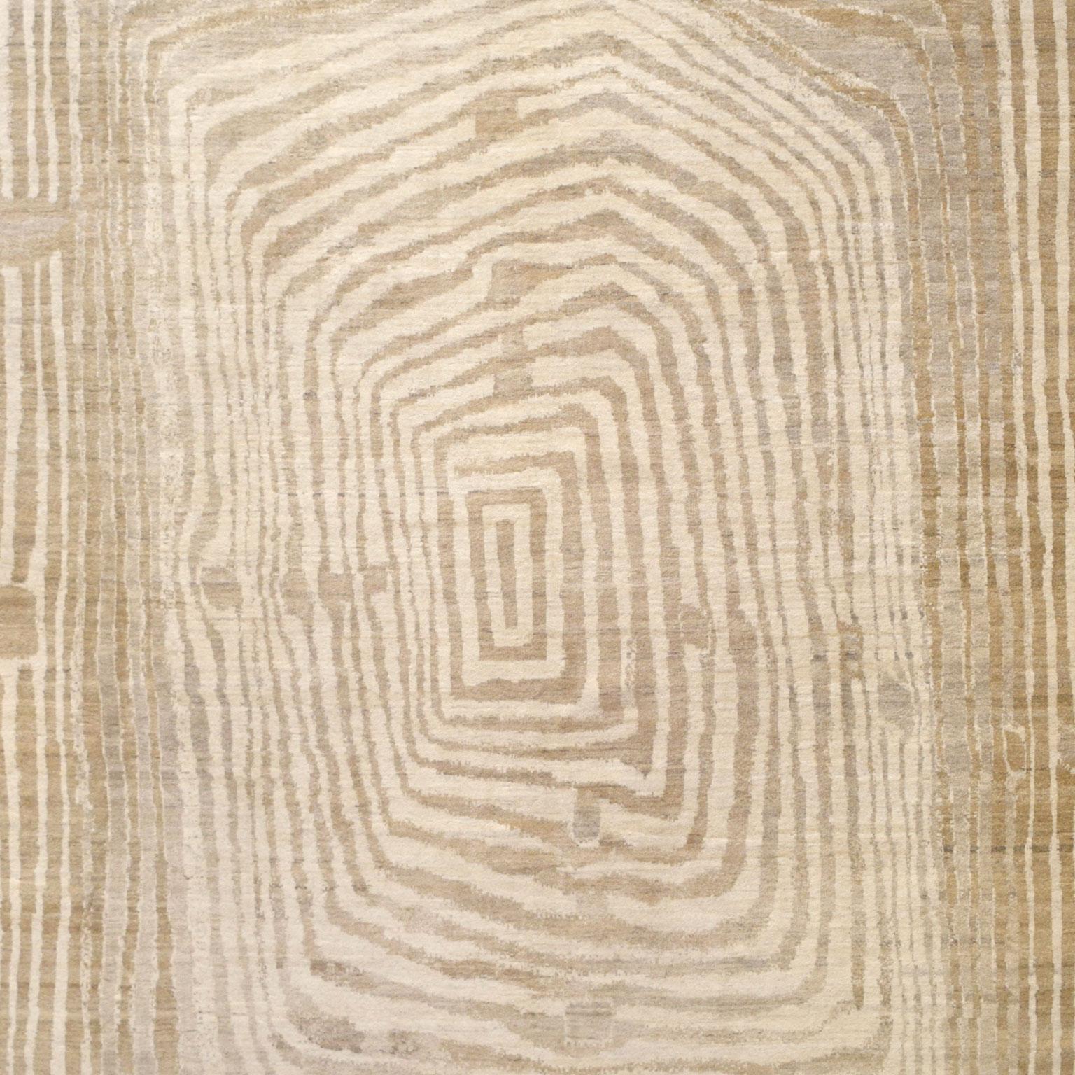 Get lost in the beauty of this abstract wool area rug. Rabbit Hole utilizes a concentric design, created in entirely undyed wool, that pulls the viewer inwards toward the center. Playing with the idea of a medallion by utilizing the negative space