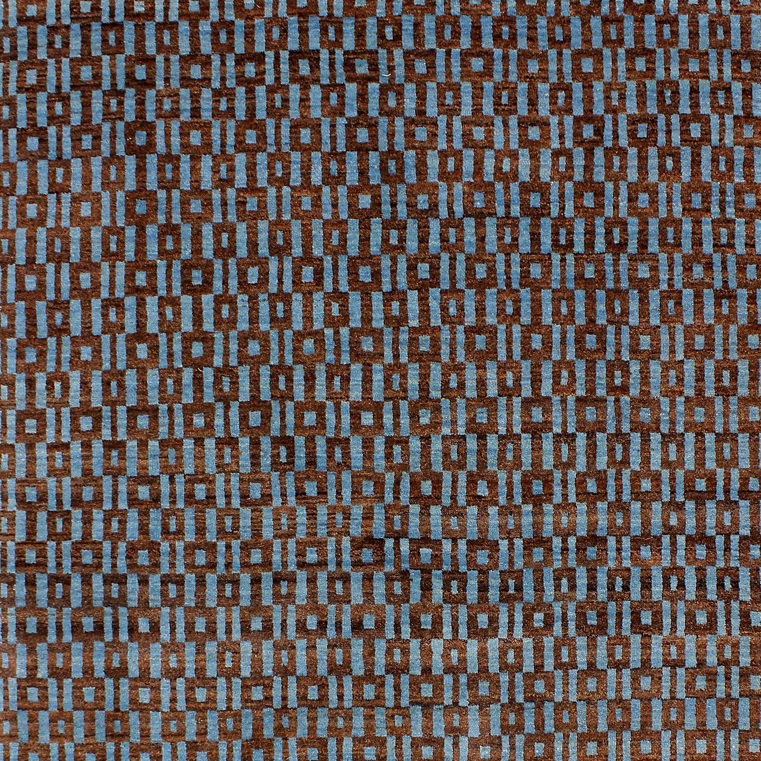 This Orley Shabahang signature “Windows” carpet in pure handspun wool and organic dyes showcases an Architectural Modern design in a hand knotted Persian weave. In a blue and brown colorway, this geometric design draws its inspiration from a