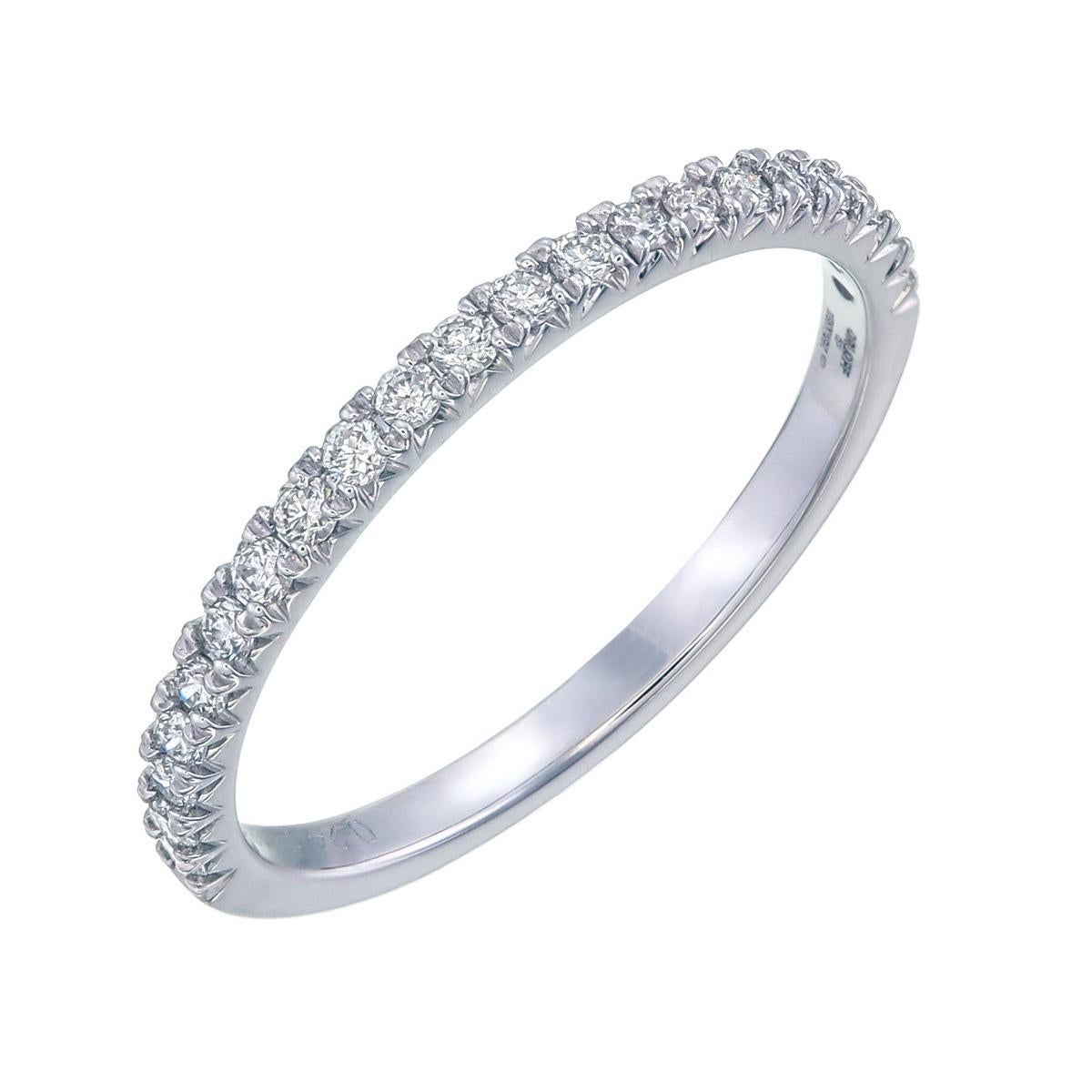 Orloff of Denmark;
The purity of 18 Karat white gold and the sparkle of 21 precision-cut diamonds unite in this sophisticated ring. Each SIW, F color diamond is a testament to clarity and craftsmanship, arranged seamlessly to create a band of light