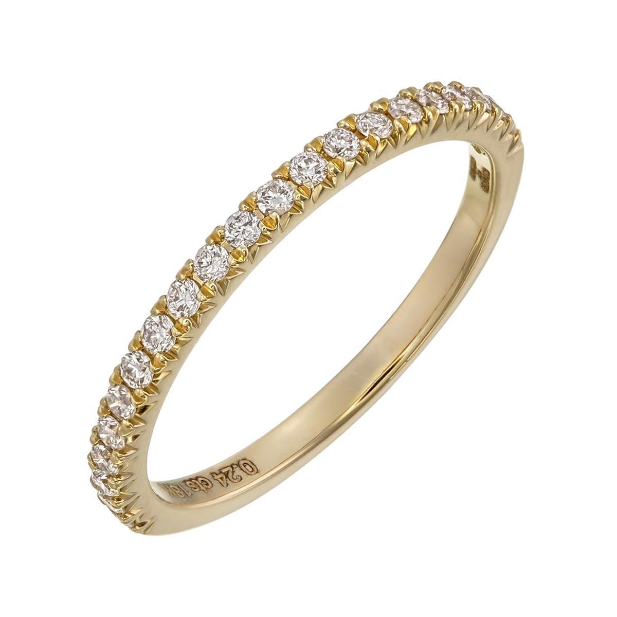 Orloff of Denmark;
Time-honored elegance finds form in this 18 Karat yellow gold ring, adorned with 21 exquisite SI2, F color diamonds. The classic half-band captures the essence of traditional design while embracing the modern allure of