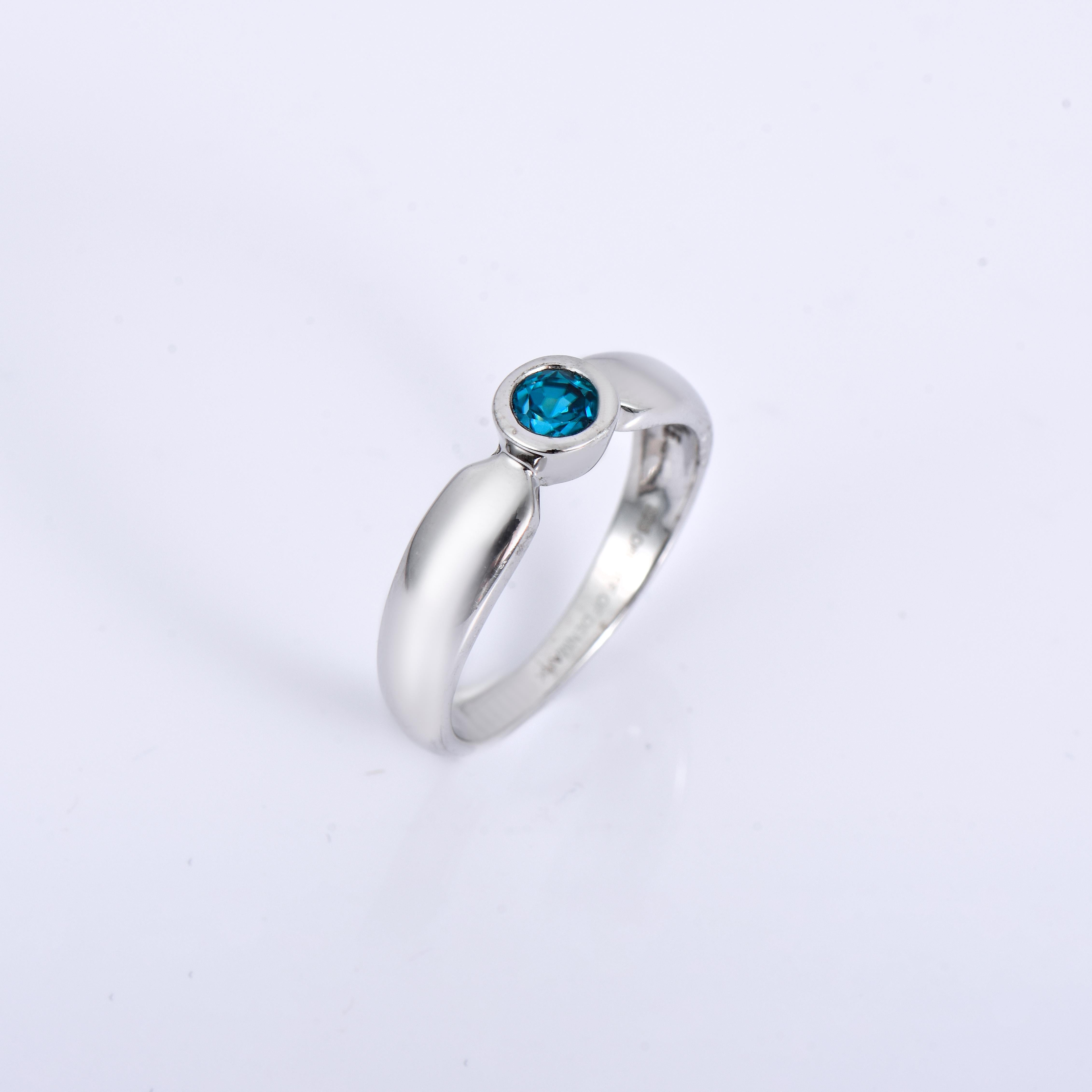 Orloff of Denmark; 925 Sterling Silver Ring set with a 0.55 carat Natural Cambodian Blue Zircon.

This piece has been meticulously hand-crafted out of 925 sterling silver.
In the center sits a 0.55 carat blue zircon mined, polished, and cut in