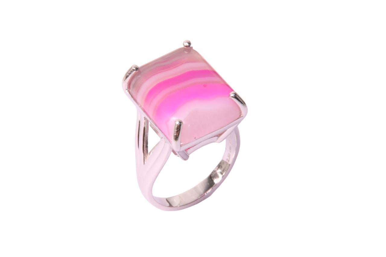 Orloff of Denmark; 12.58 carat Pink Agate Ring fashioned out of 925 Sterling Silver.

This chic ring features a 12-carat Pink Agate, showcasing soothing gradients of pink that ripple across the stone in bands of light and dark shades. The agate's