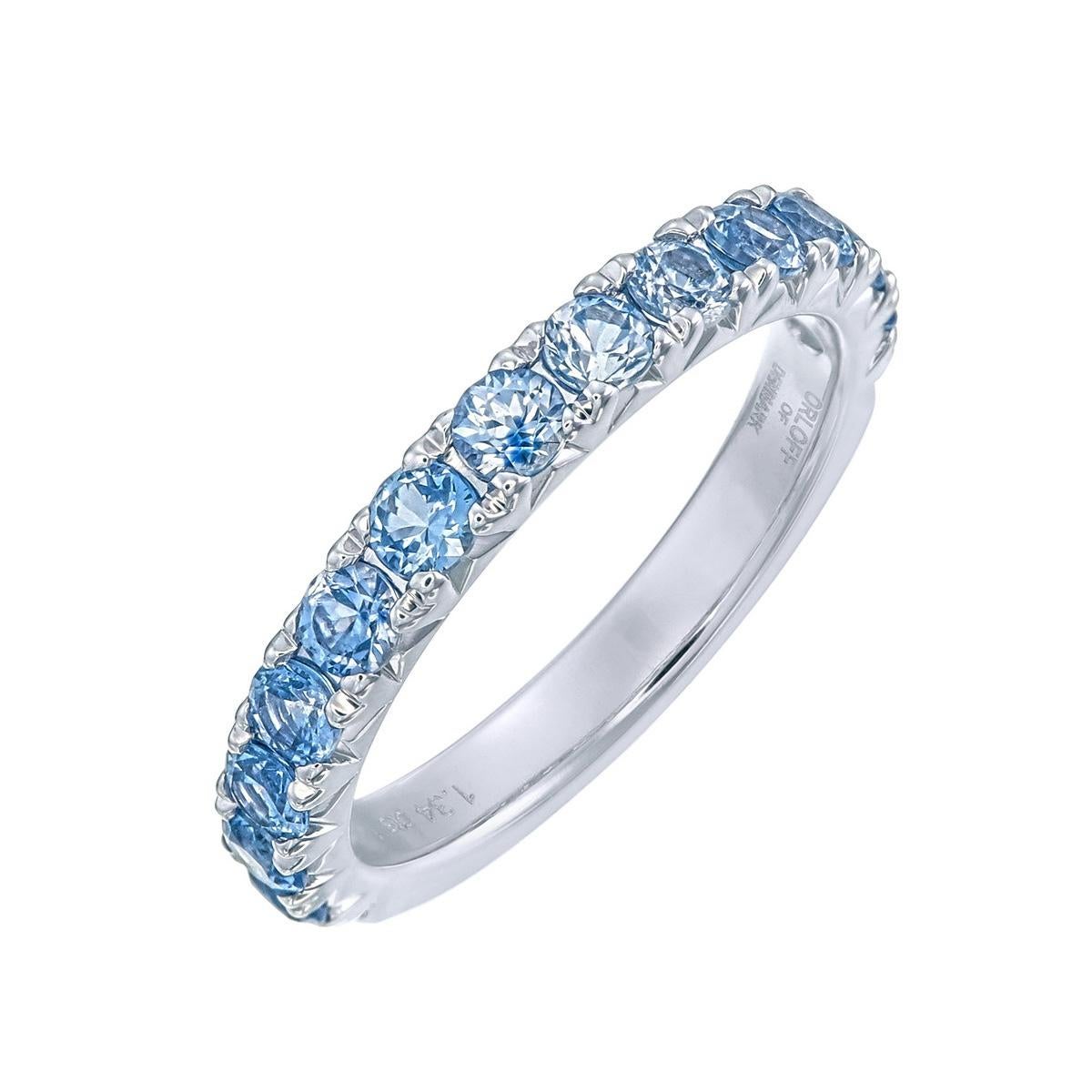 Orloff of Denmark;
Drape your finger in the cool elegance of this 1.34 carat Blue Sapphire Half-Band Ring, set in the timeless sophistication of 14 Karat white gold. Each sapphire, meticulously chosen for its vibrant azure hue, aligns in a delicate